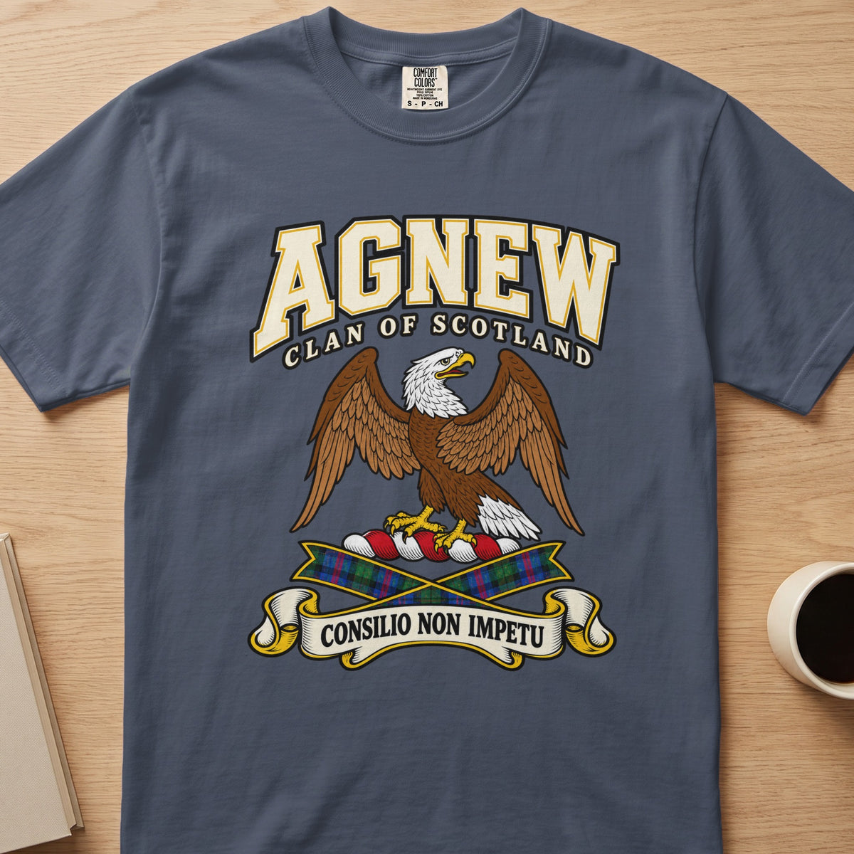 Agnew brown spread-wing bird crest graphic on a slate blue Comfort Colors T-shirt, front view