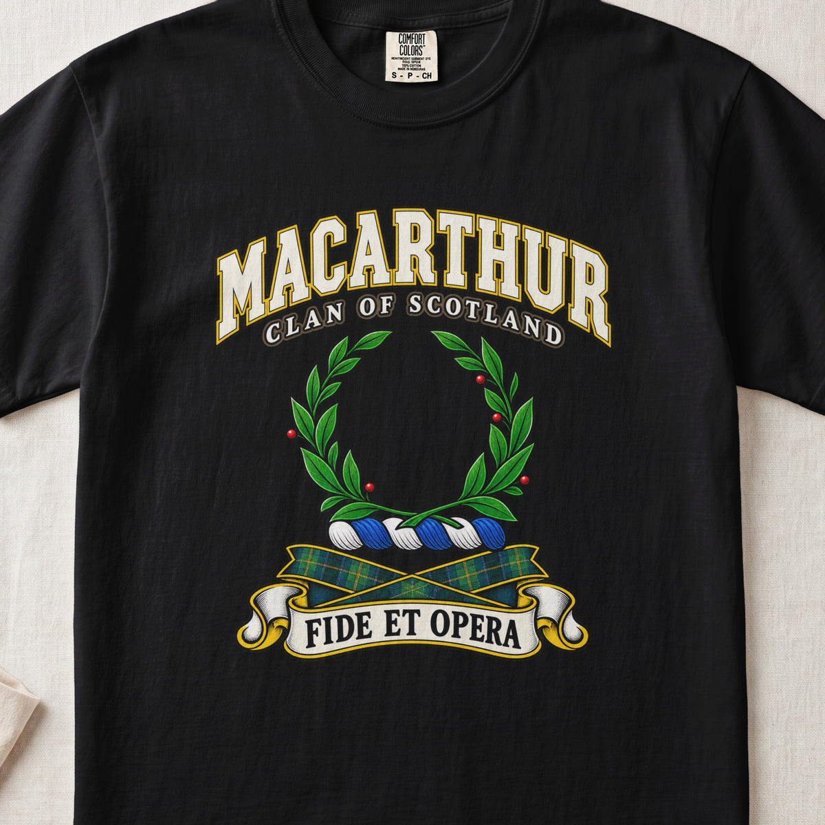 MacArthur Scottish clan T-shirt in Black, front view with a green laurel wreath and motto design.