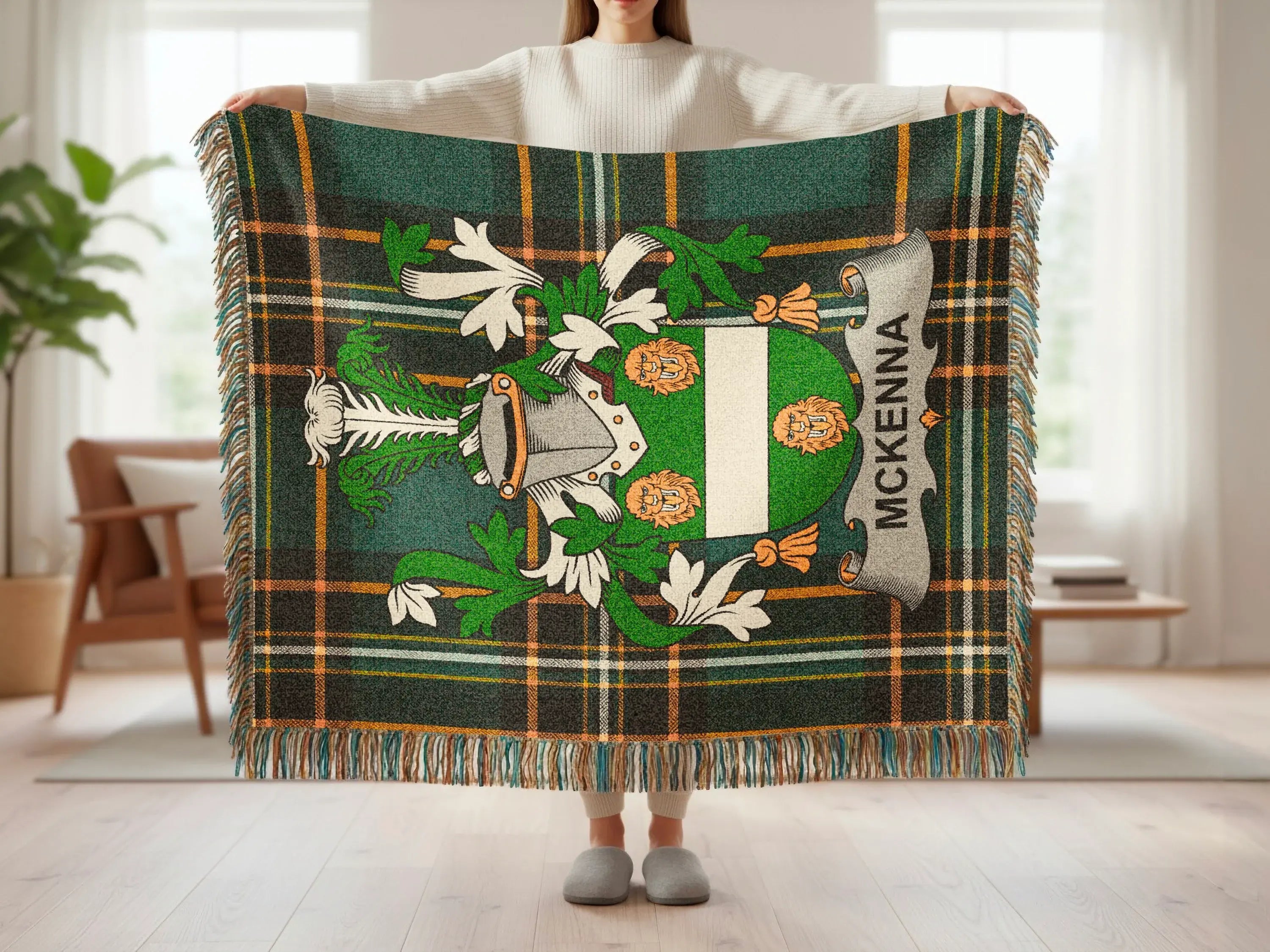 Tartan plaid blanket with the McKenna family crest in the center.