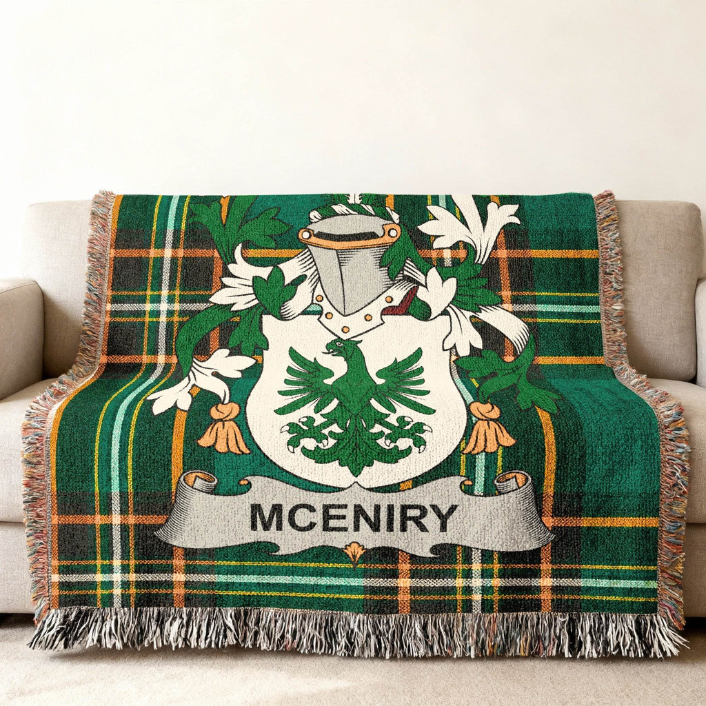Green plaid throw blanket with MCENIRY family crest featuring a white eagle.