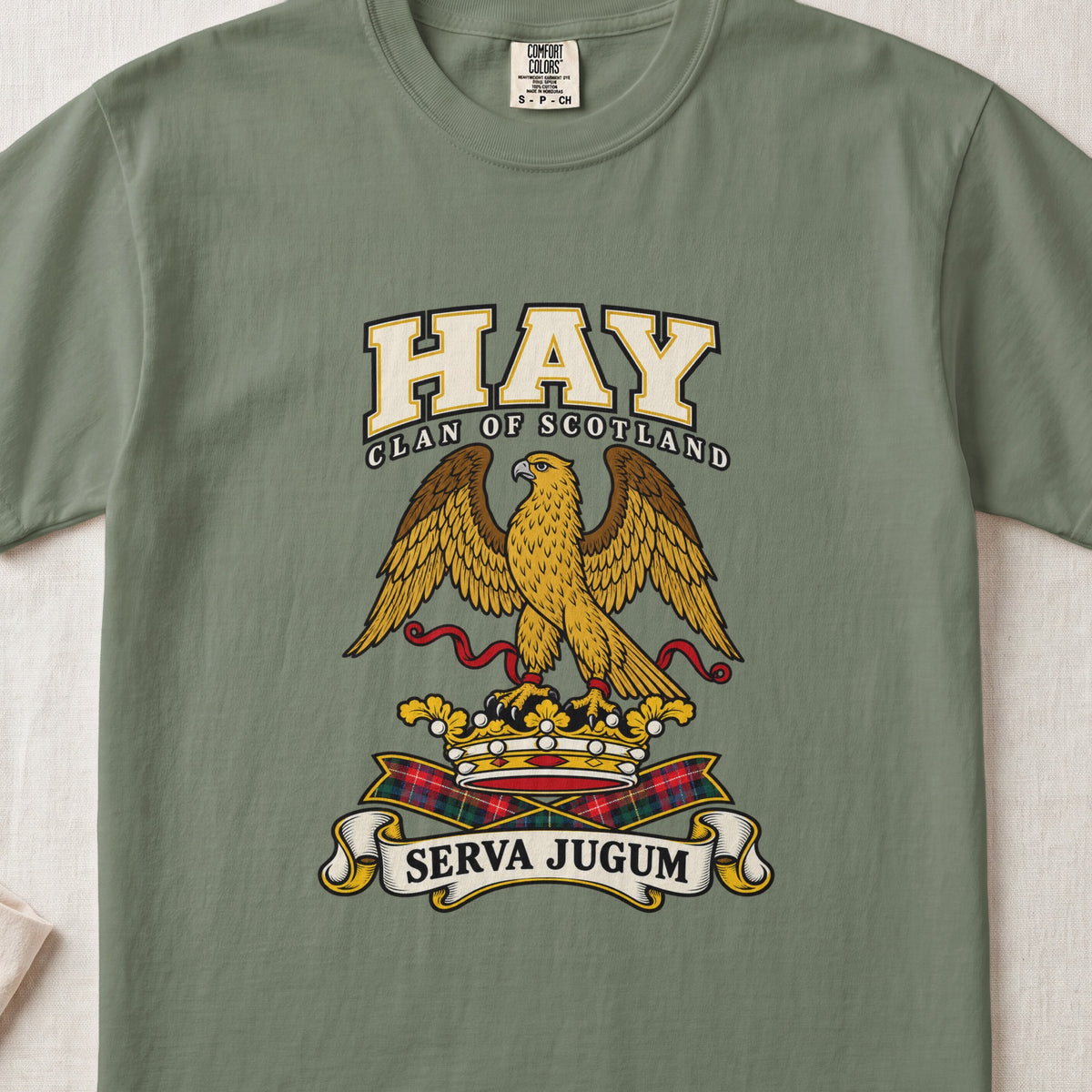 Hay graphic T-shirt in Moss green, front flat lay showing varsity lettering and gold eagle with spread wings and red ribbon.