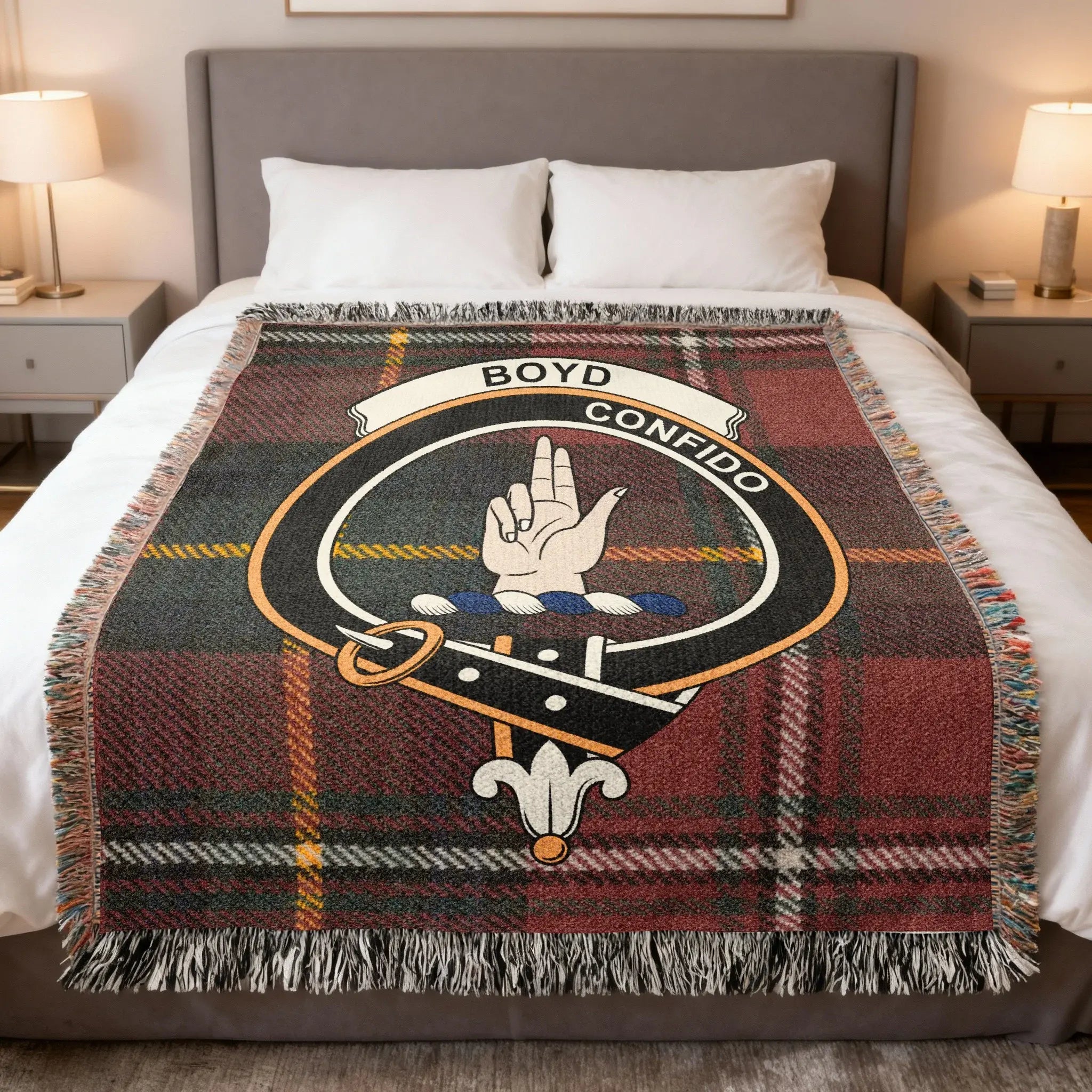 Boyd clan tartan woven blanket on sofa — 100% cotton with red-green plaid and clan crest