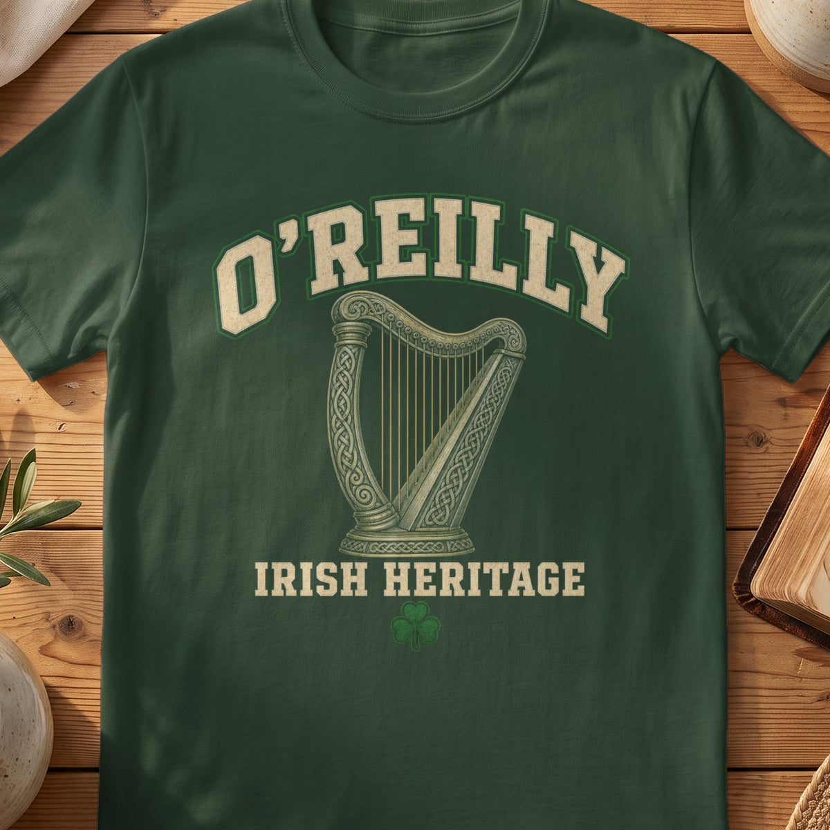 O'Reilly Irish harp T-shirt in Forest Green, with cream surname lettering, a gold-toned harp, green shamrock and “Irish Heritage” text.