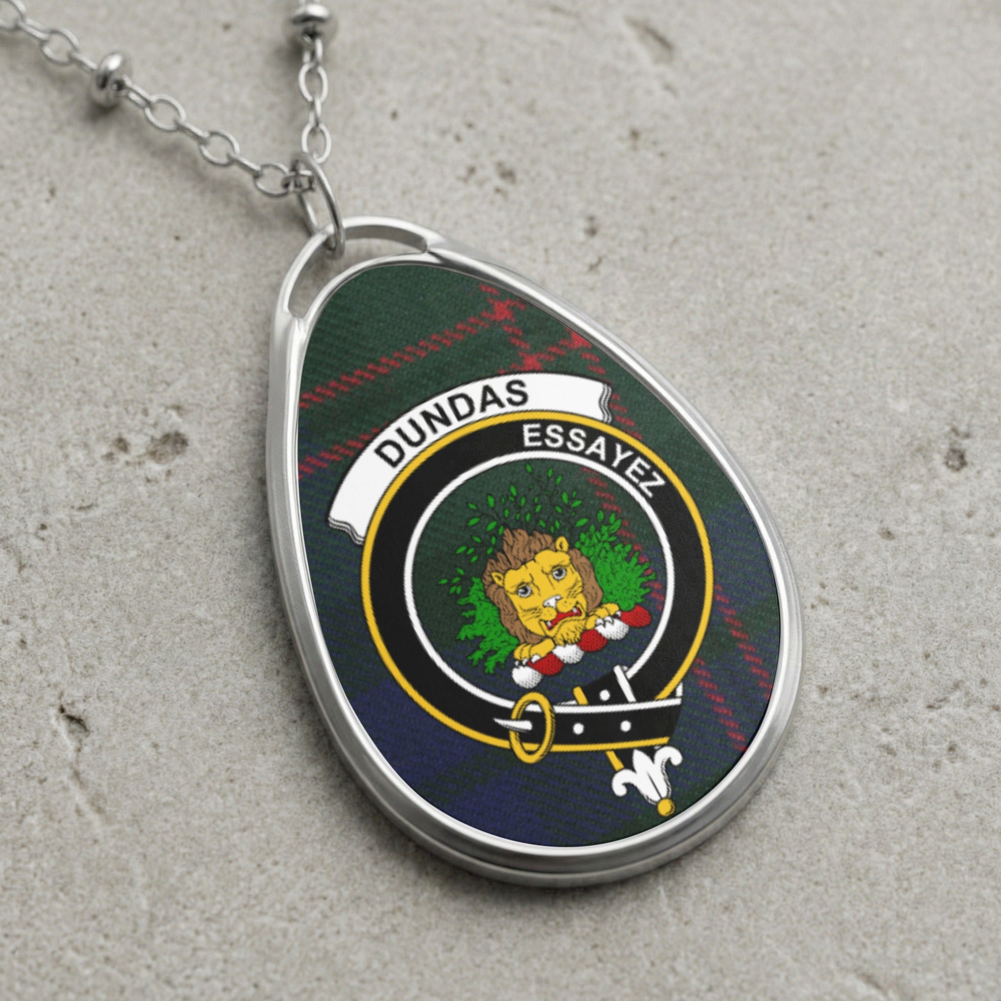 Dundas clan Scottish tartan necklace with clan crest and Essayez motto on tartan background
