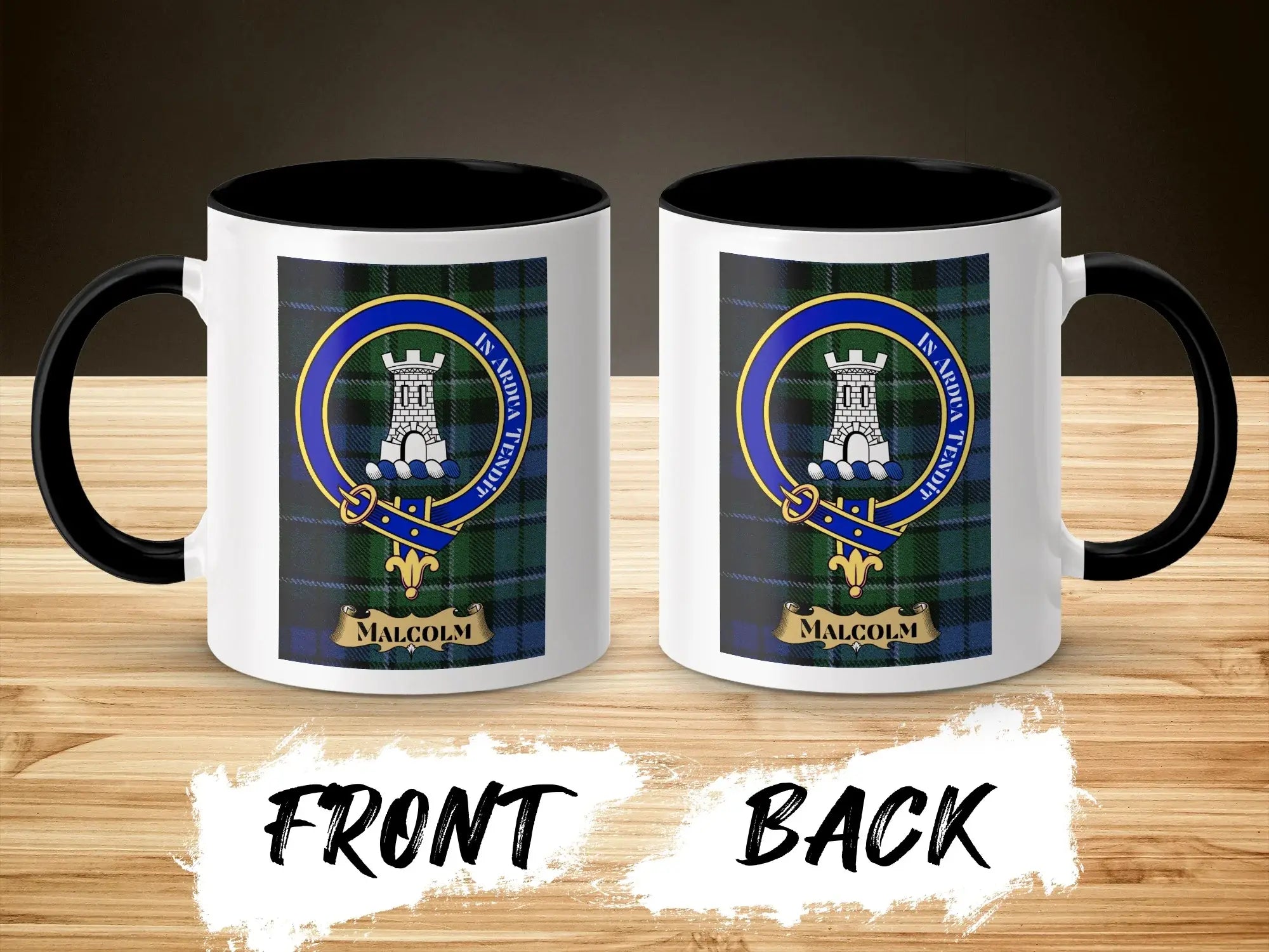 Malcolm clan crest mug shown front and back — tower above waves crest on glossy ceramic, wooden surface