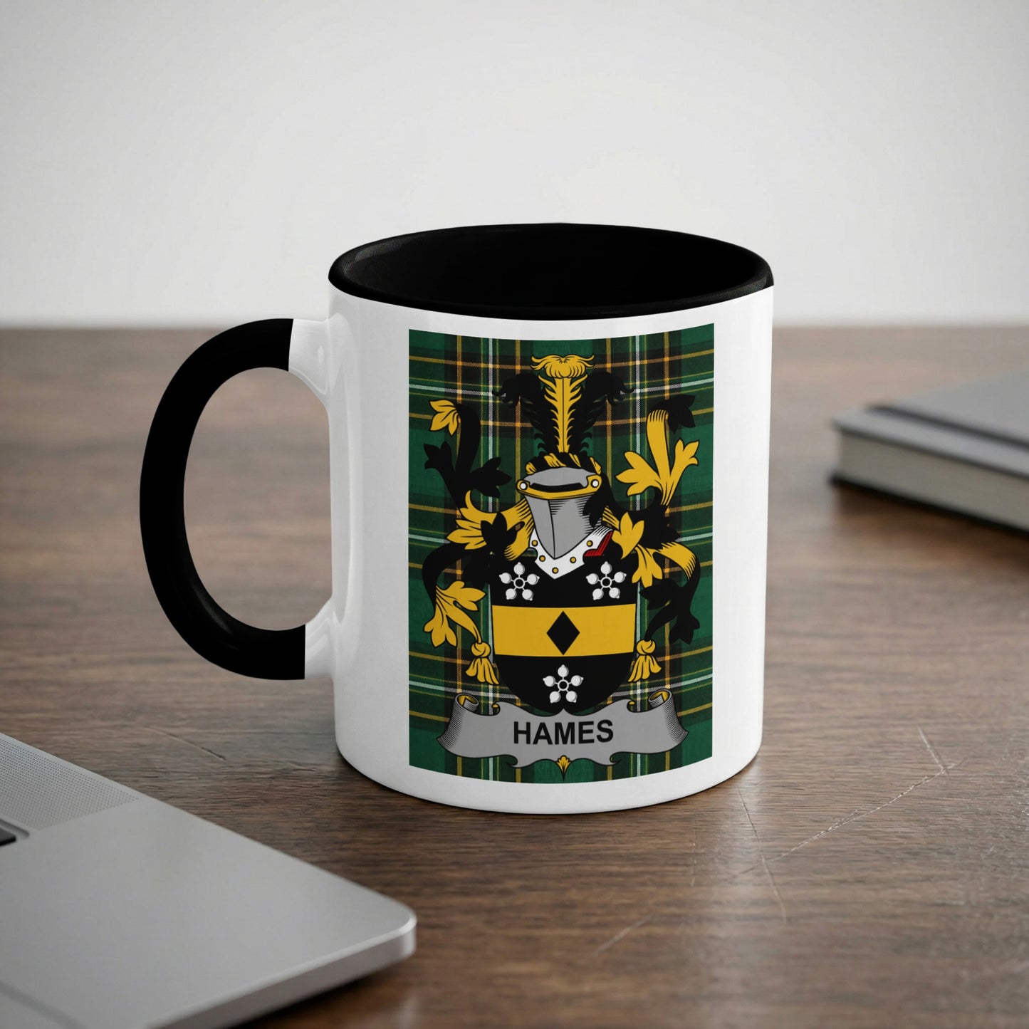 White mug with black rim featuring the Hames family crest on a checkered background.