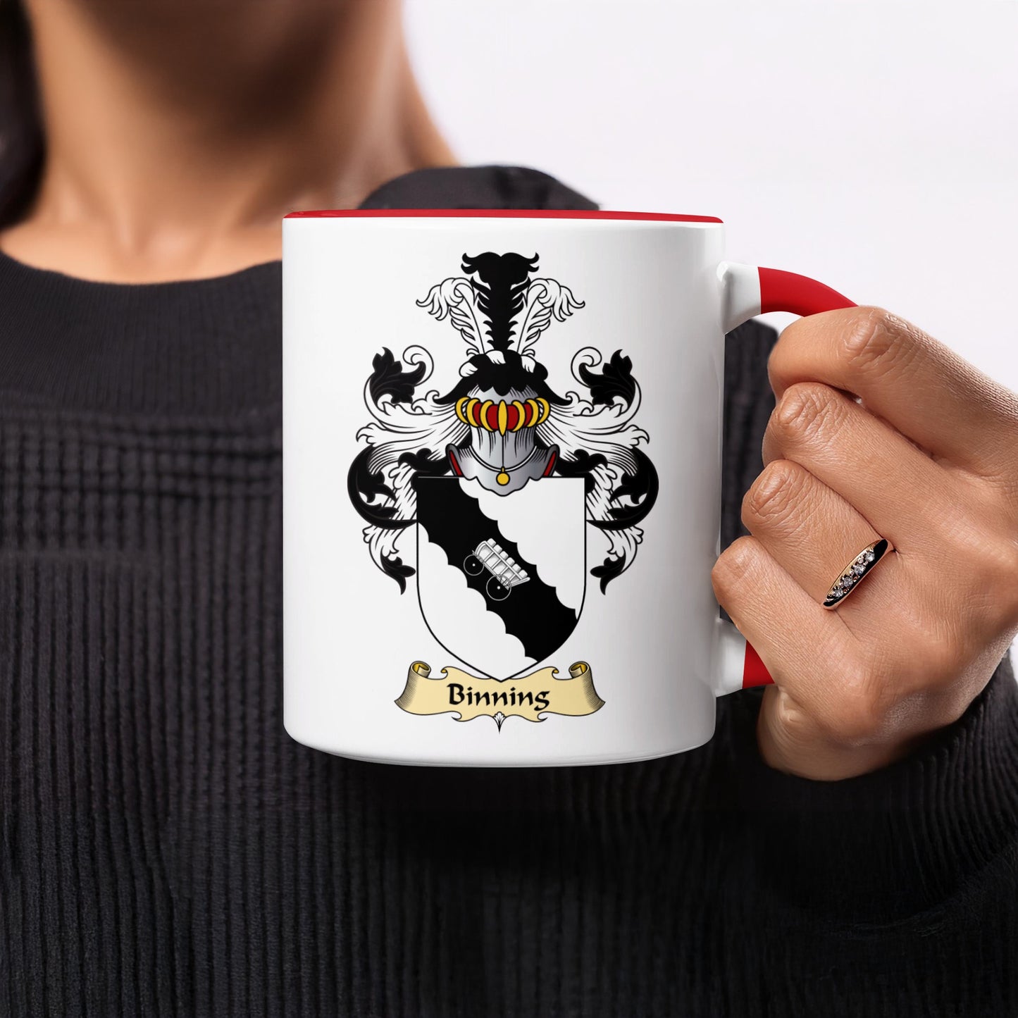 White mug with red handle, featuring the Binning family crest.
