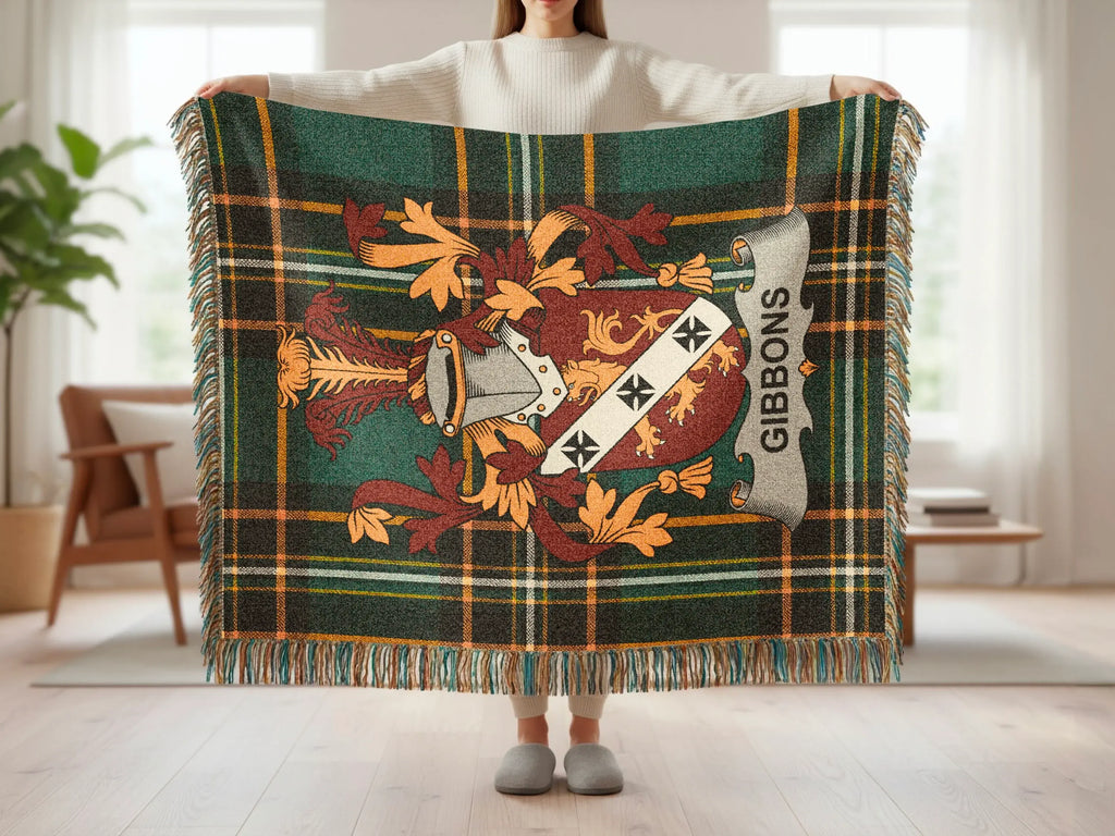 Green plaid throw blanket with Gibbons family crest and fringe.
