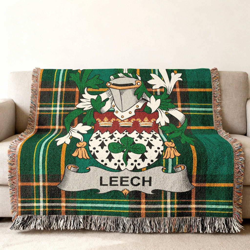 Green plaid throw blanket with Leech family crest.