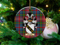 Bunkell Scottish clan ceramic ornament with family crest on a Caledonia tartan background, hanging on a Christmas tree