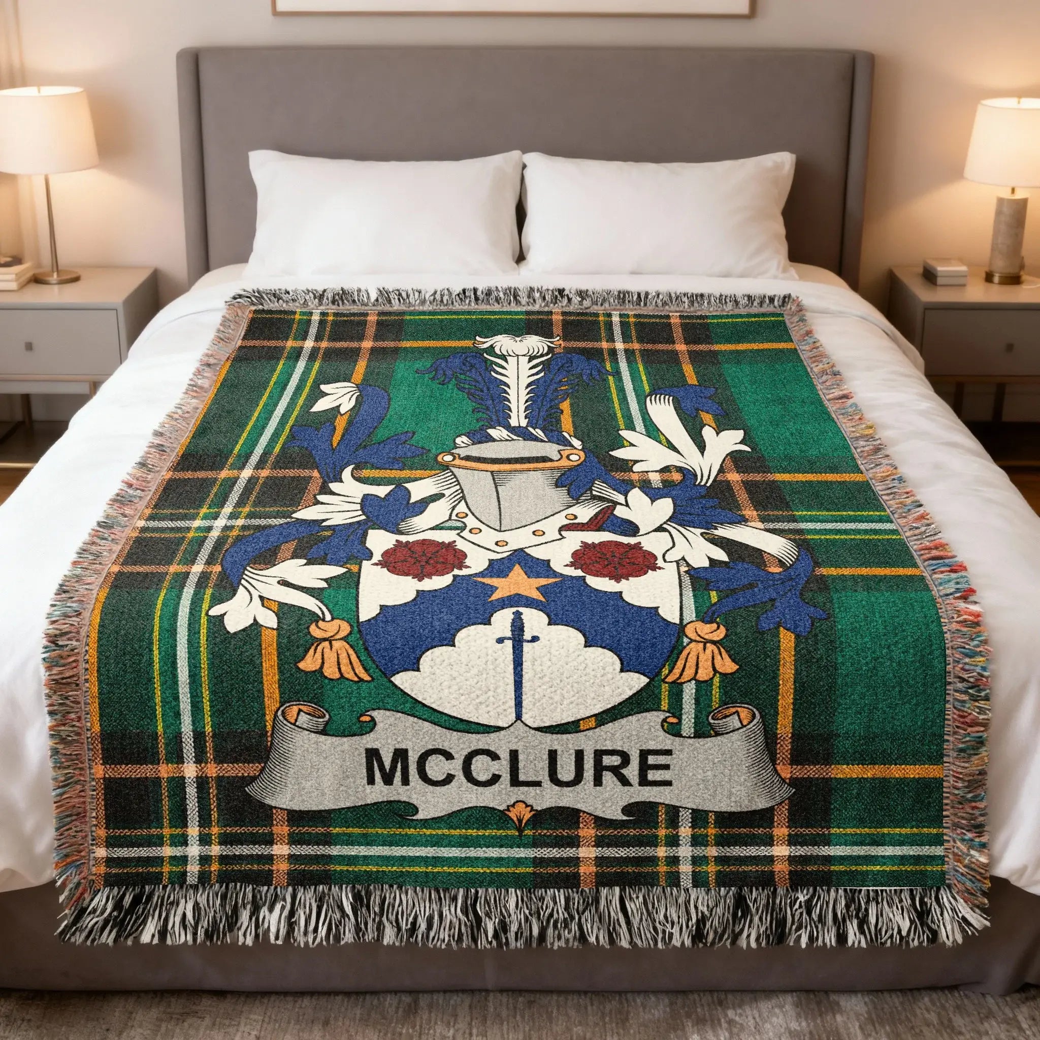 McClure family crest on a green tartan blanket with fringe.