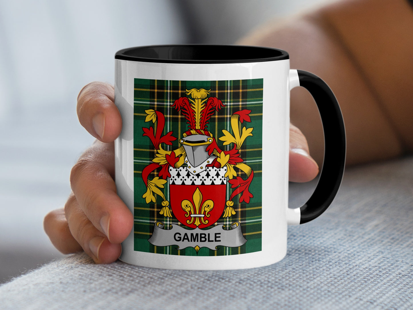 Mug with Gamble family crest on plaid background.