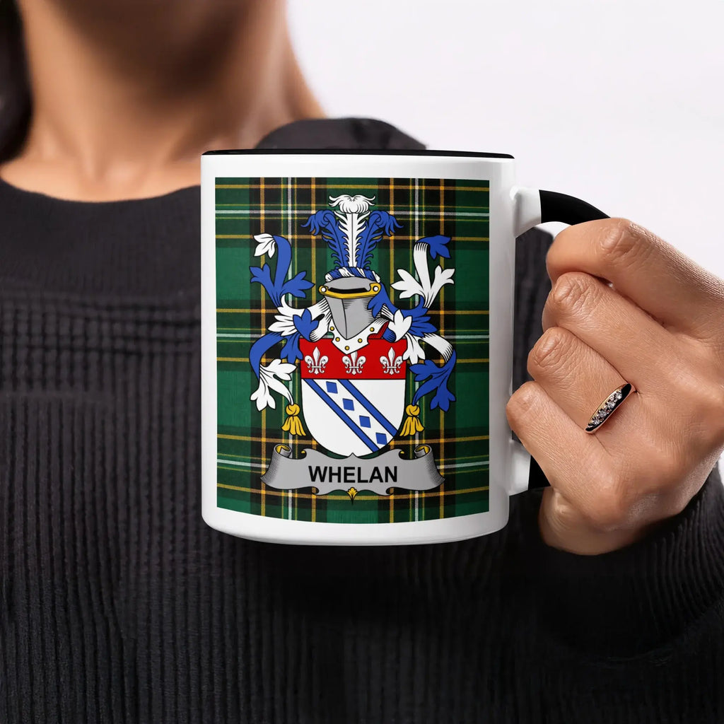 Mug with Whelan family crest on green plaid background.