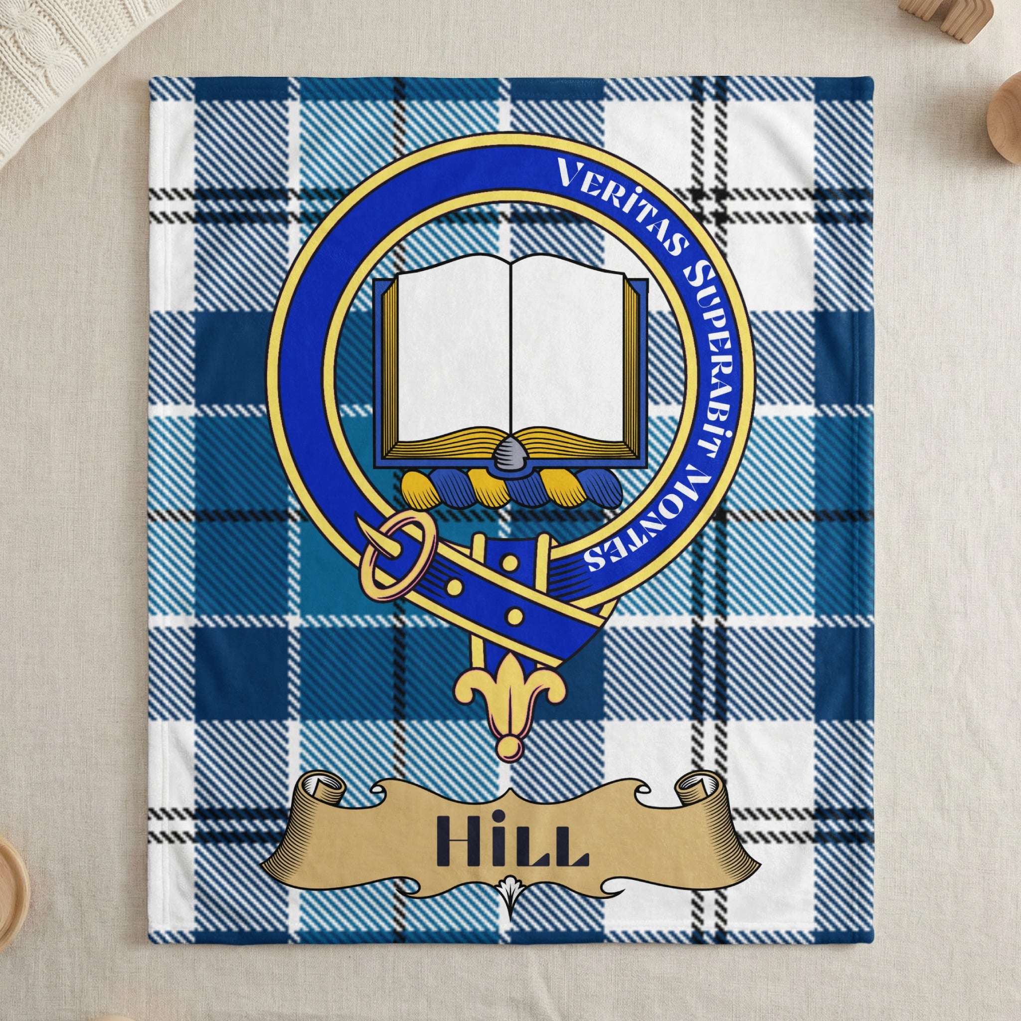 Hill clan blue tartan throw blanket with crest — draped display