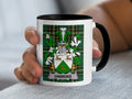 White mug with black rim displaying the Hawkins family crest on a tartan background.