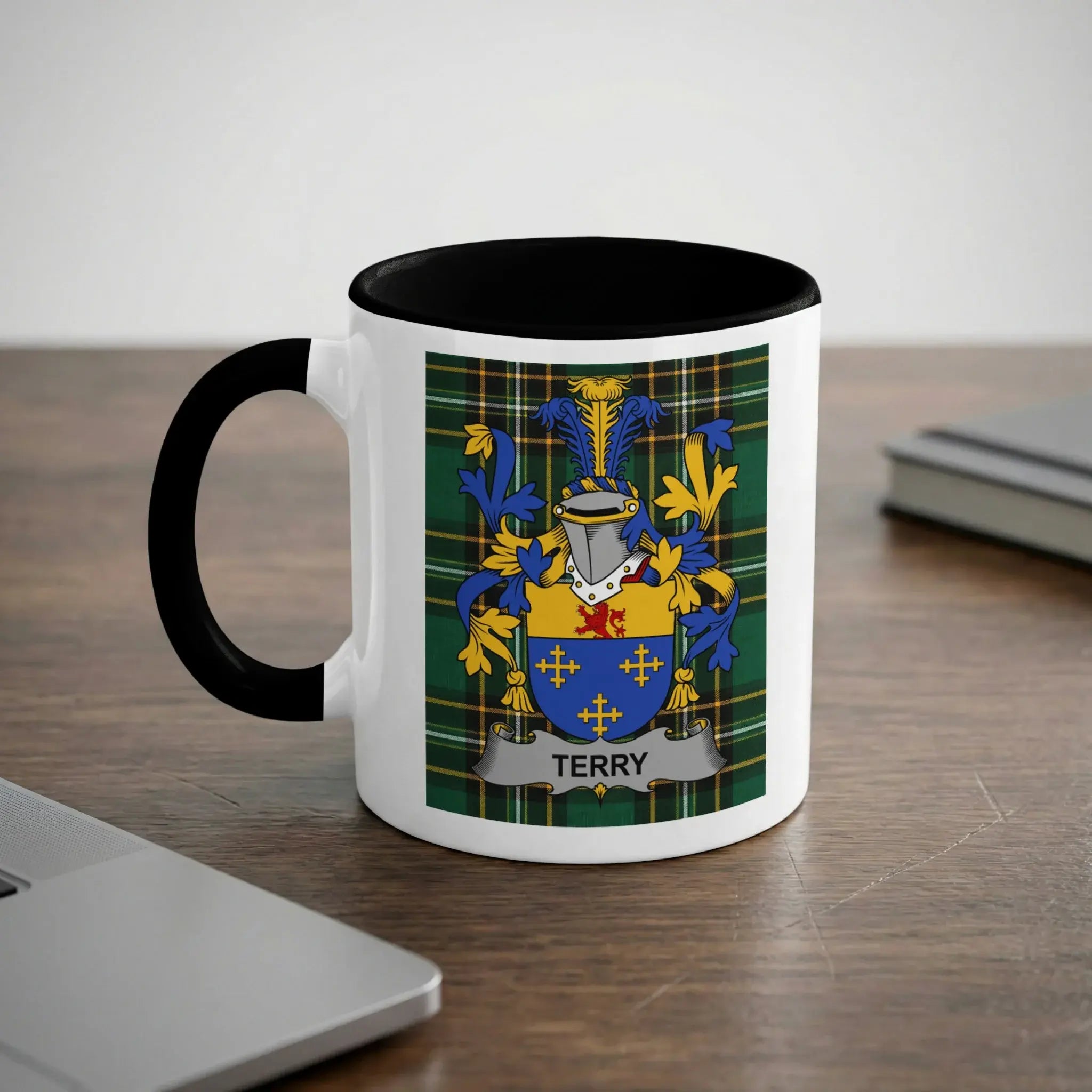 White mug with black handle featuring the Terry family crest.
