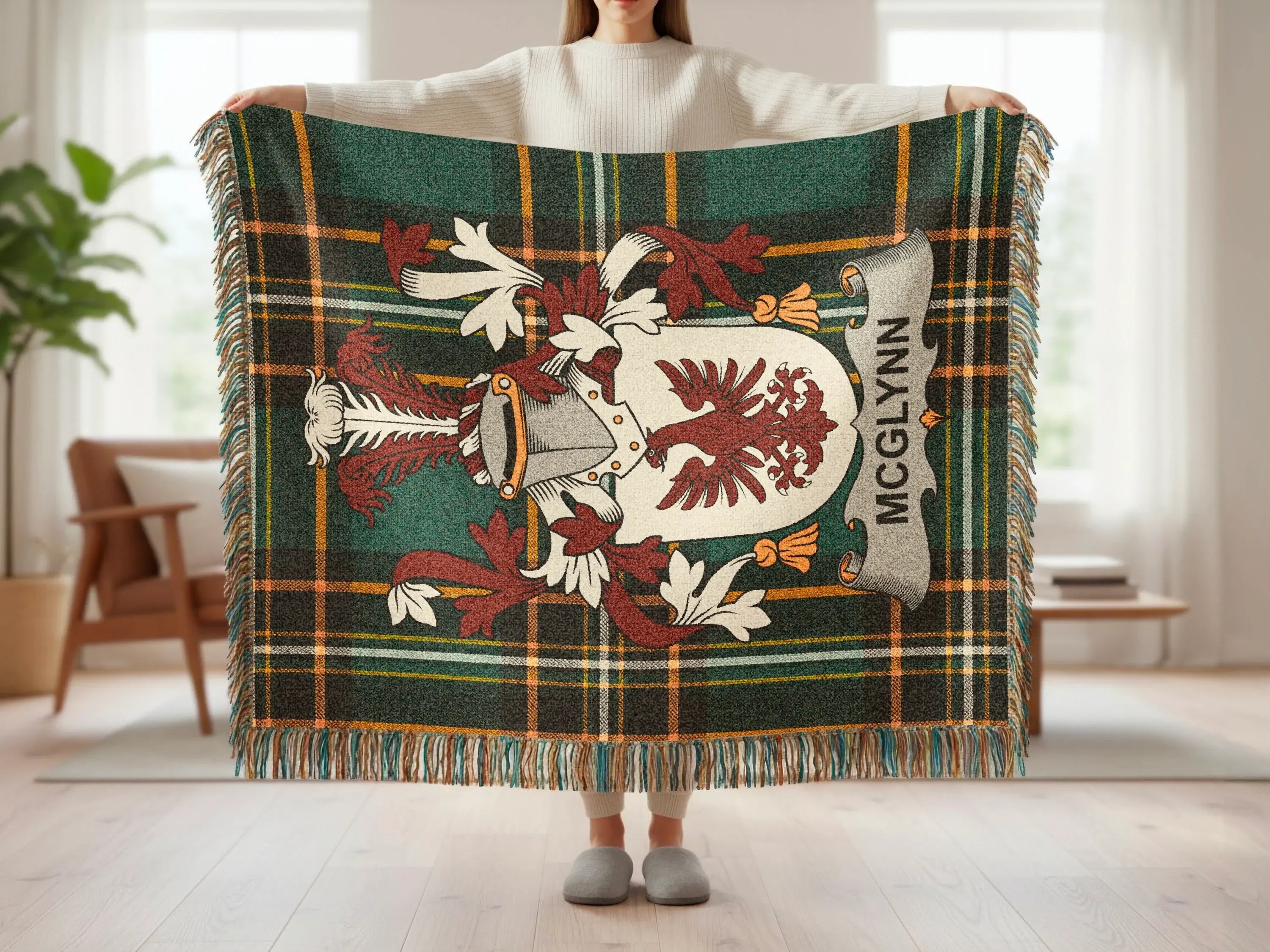 Green and brown plaid throw blanket with McGlynn family crest.