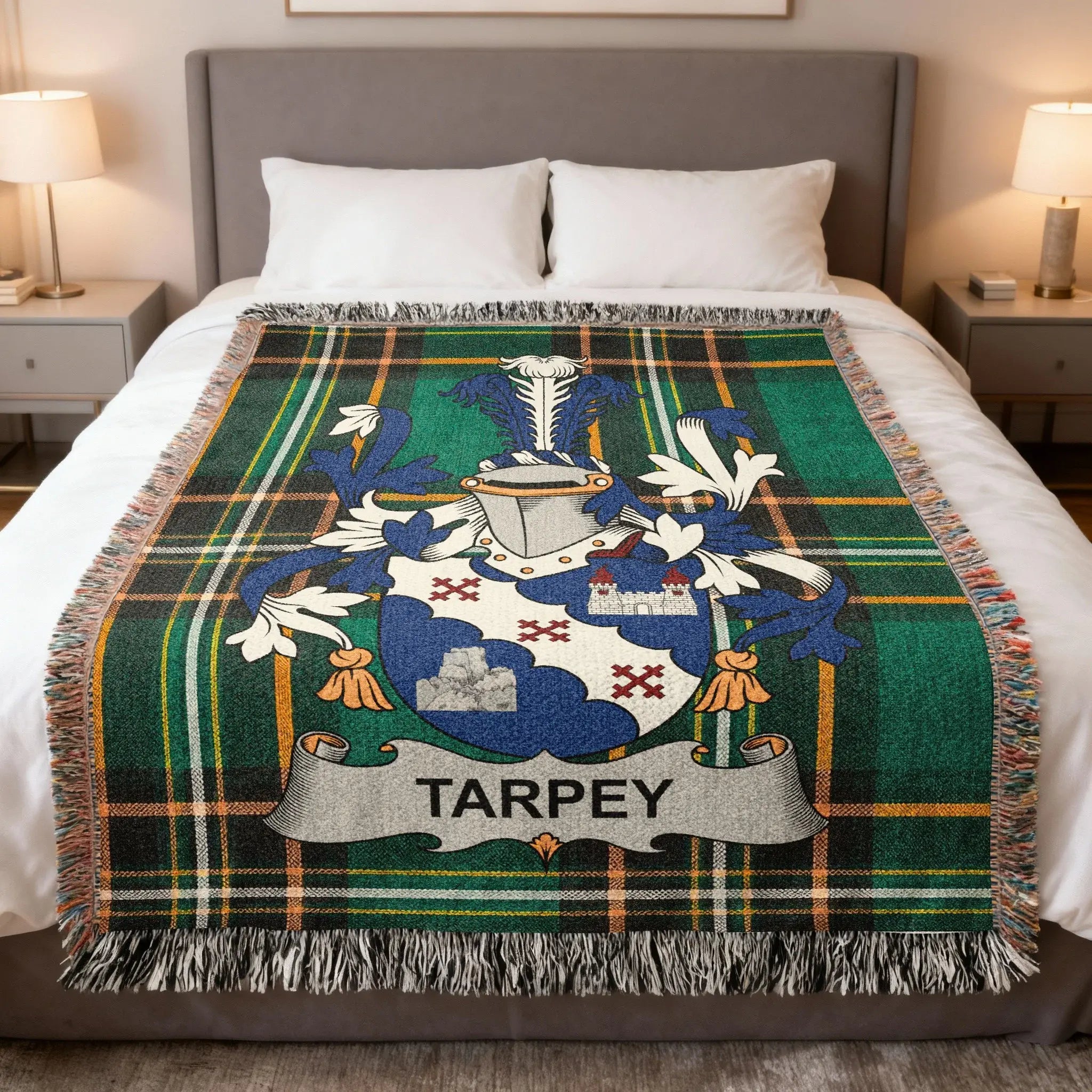 Tarpety family crest on a green and black plaid woven throw blanket.