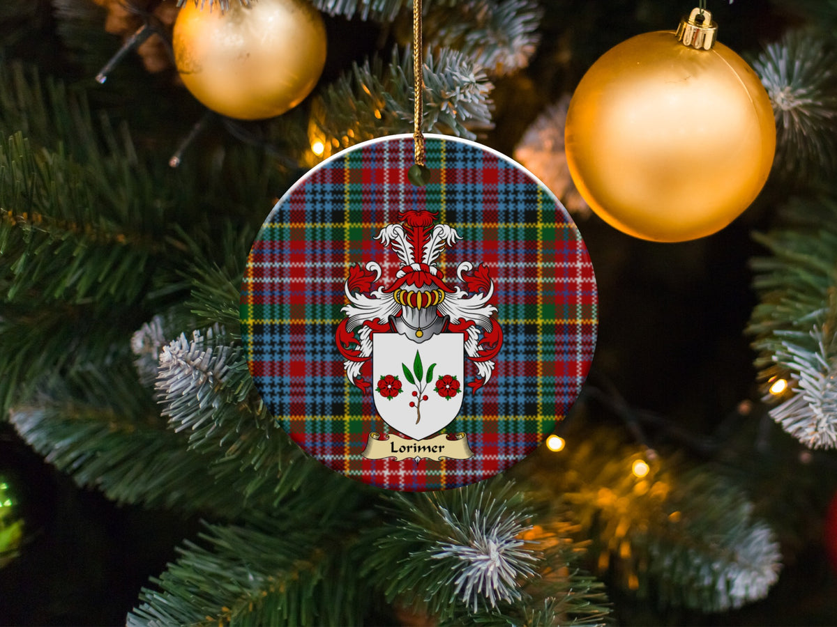 Lorimer family emblem ceramic Christmas ornament with Caledonia tartan background in festive holiday décor