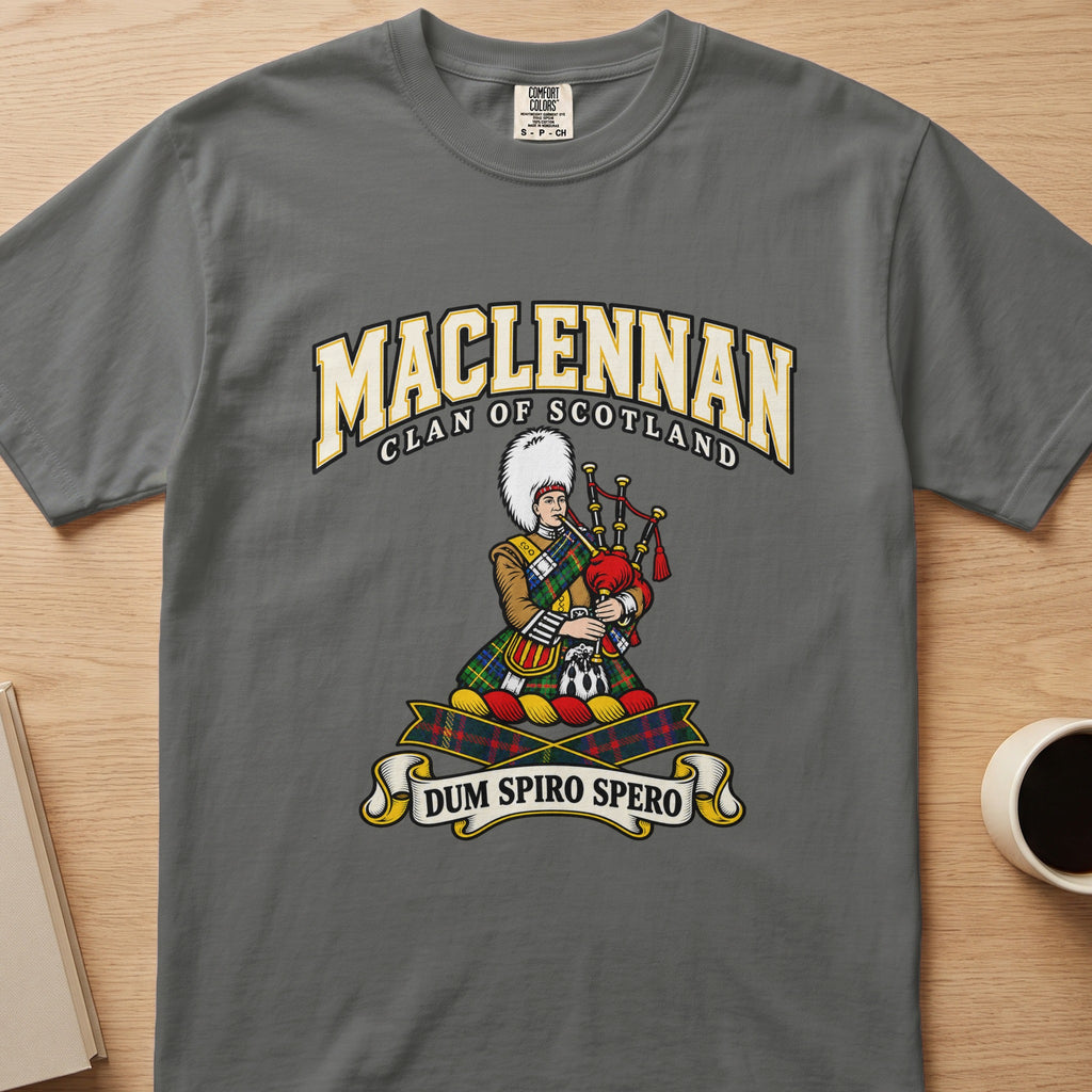 MacLennan clan crest with tartan-clad piper on a gray Comfort Colors T-shirt, front view