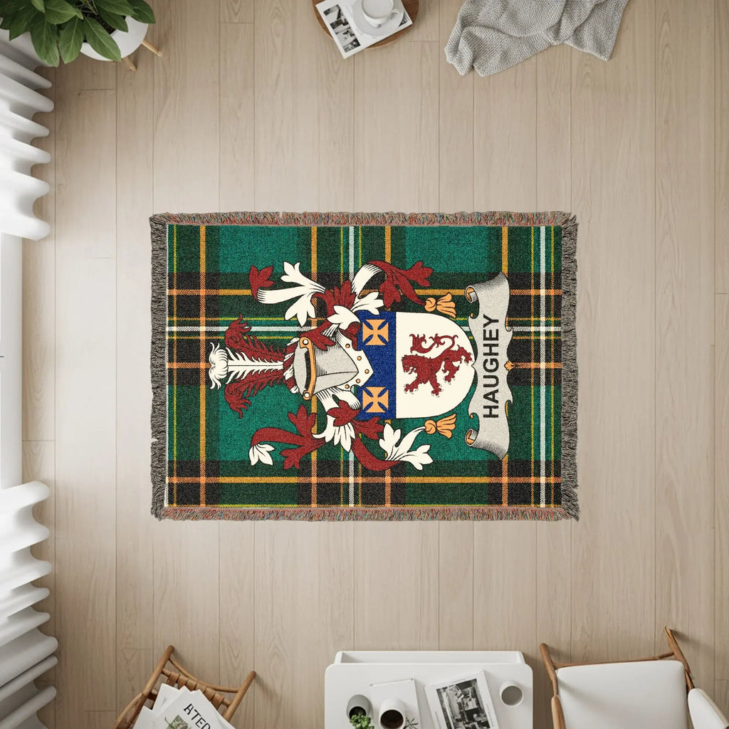 Green tartan blanket with the Haughey coat of arms.