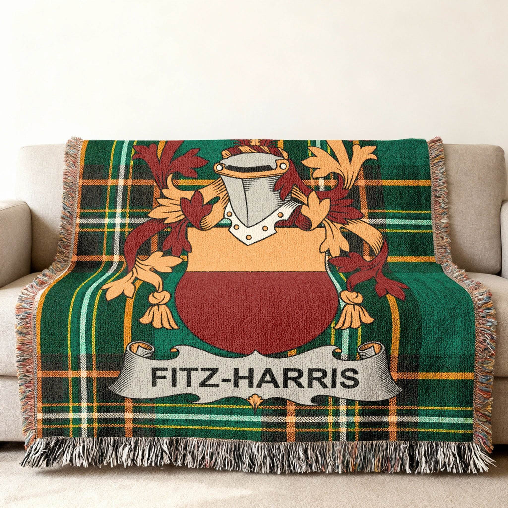 Fitz-Harris family crest on a green plaid woven throw blanket.