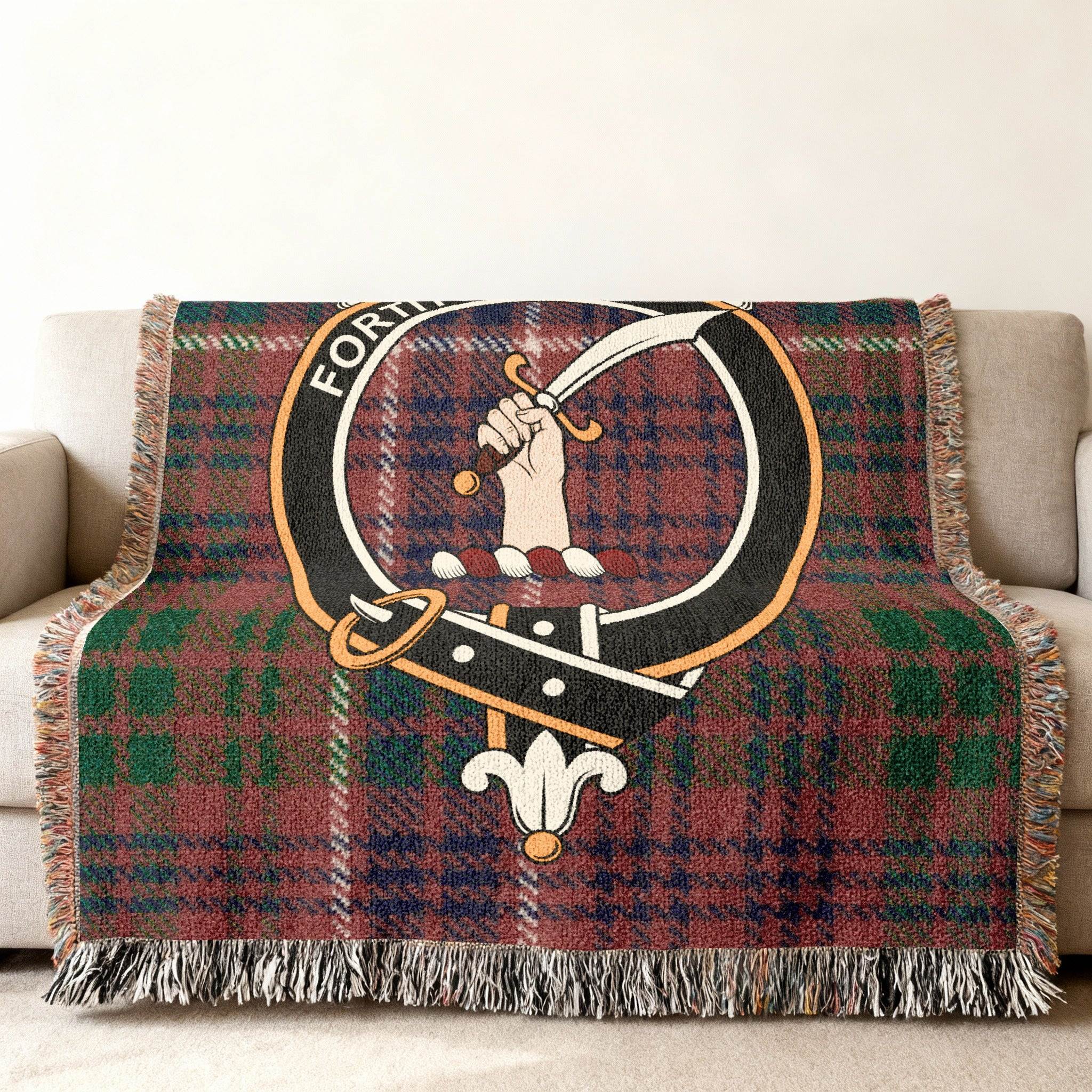 MacRae clan crest tartan woven throw blanket over sofa — full pattern in Scottish clan colours