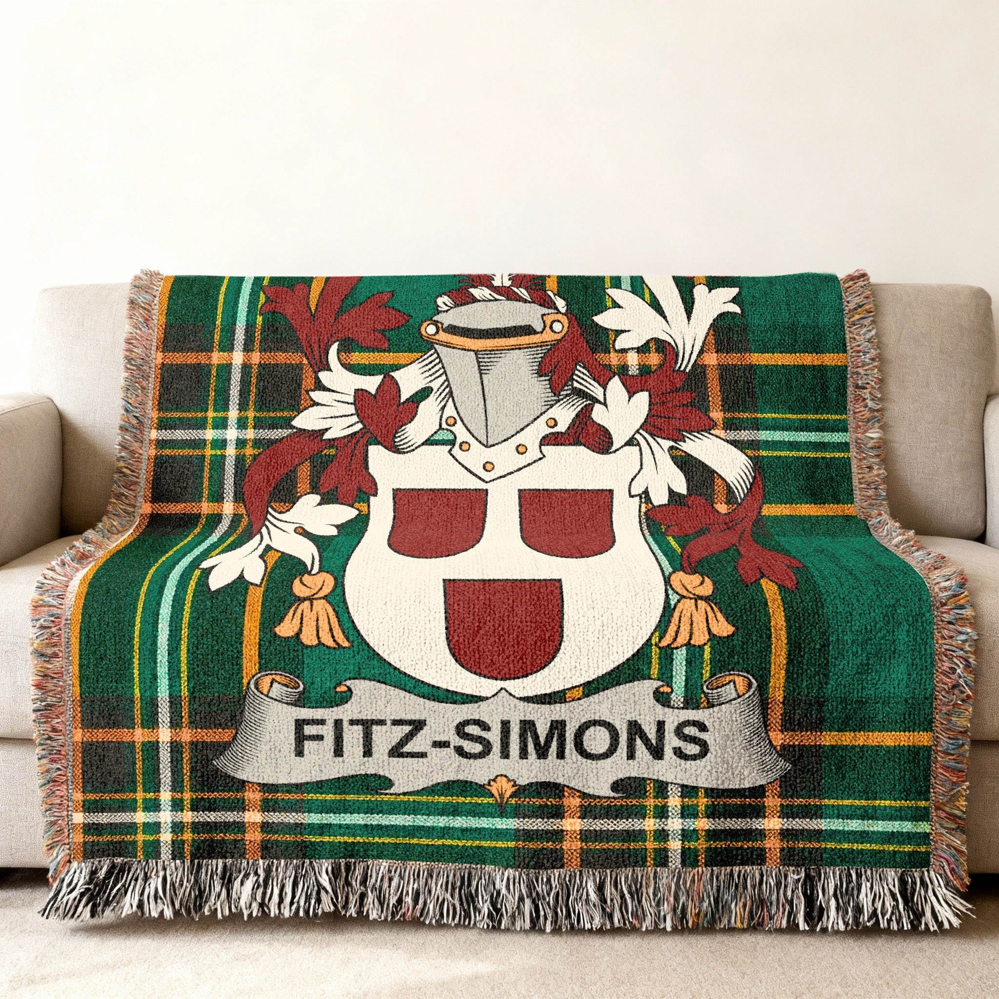 Fitz-Simons family crest on a green plaid woven blanket on a sofa.
