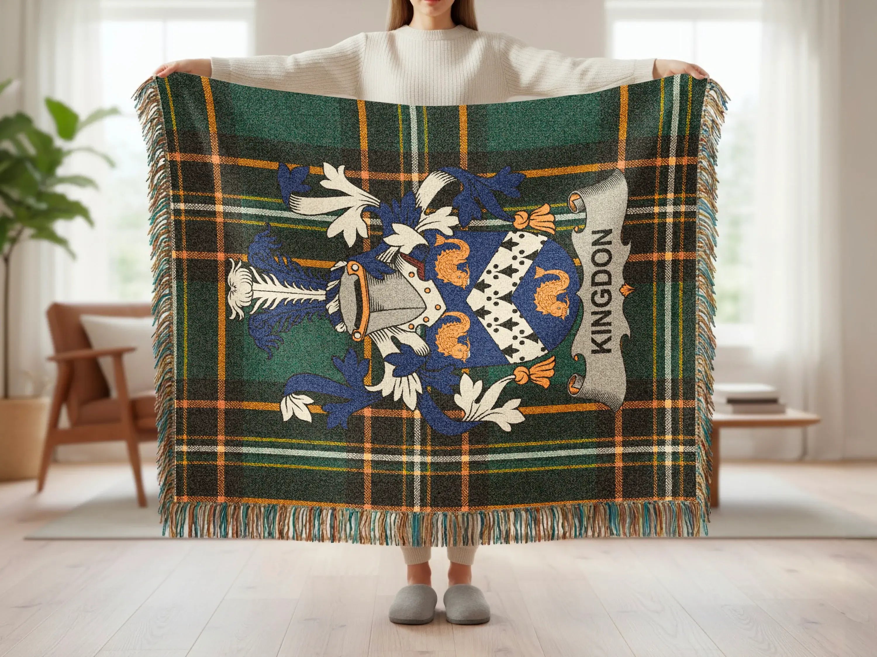 Tartan blanket with a blue and orange crest and "KINGDON" banner.