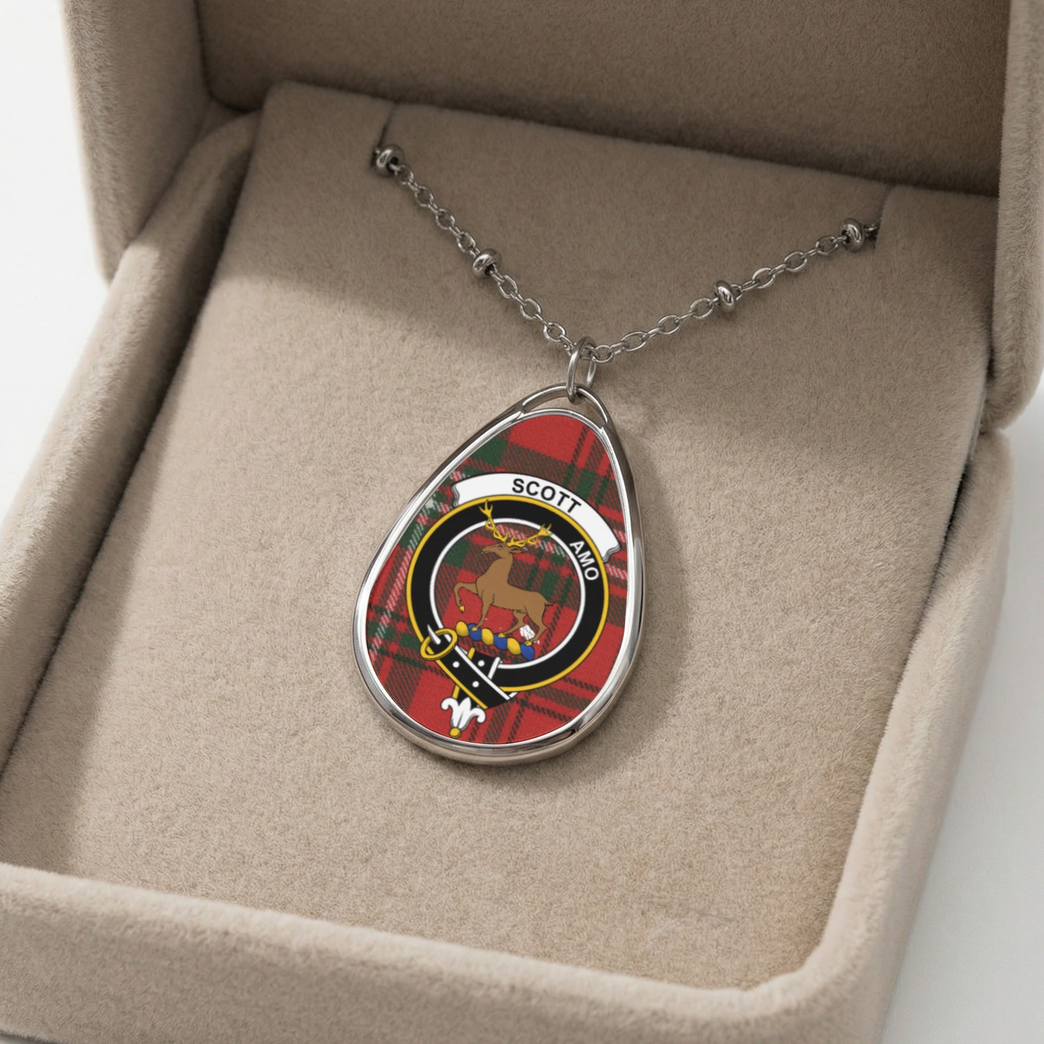 Scott Amo oval pendant necklace with Scottish tartan and stag emblem.