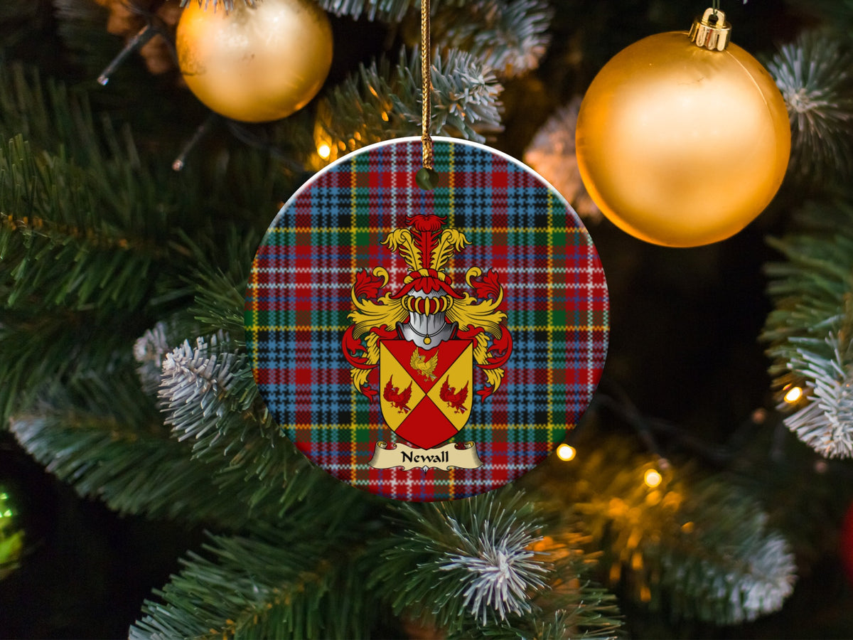 Newall family emblem ceramic Christmas ornament with Caledonia tartan background in festive holiday décor