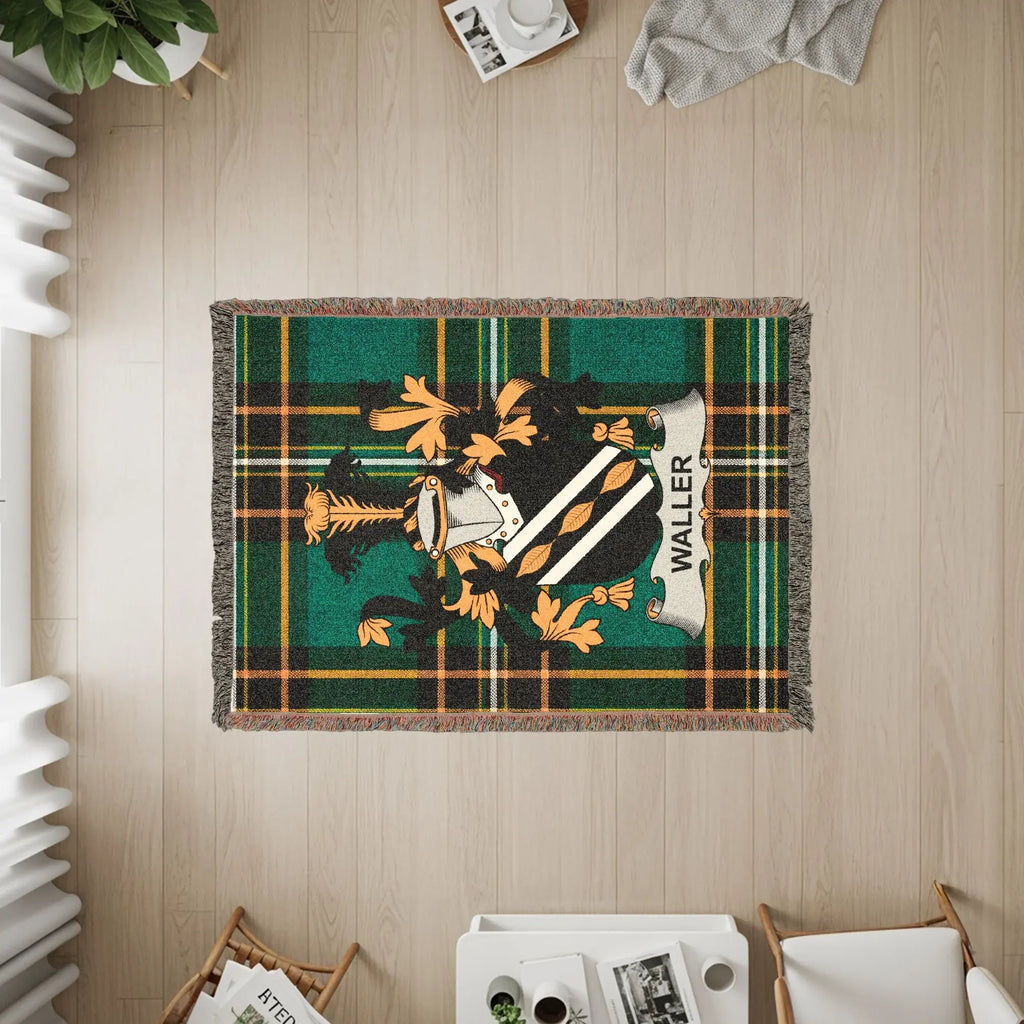 Tapestry blanket with green tartan plaid and the Waller family crest.