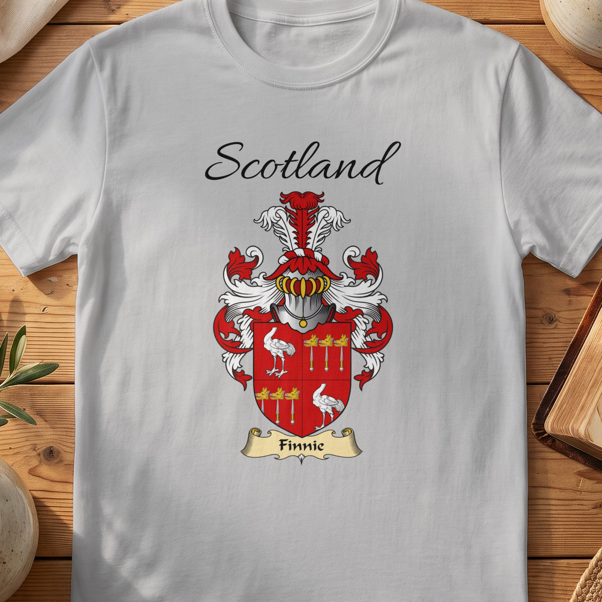 Sport Grey Finnie Scottish family shield T-shirt featuring a quartered red design with small white figures