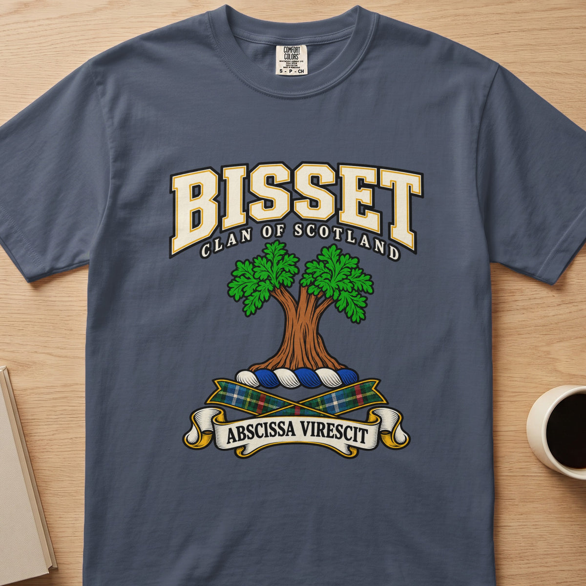 Bisset double-canopied green tree crest graphic on a slate blue Comfort Colors T-shirt, front view