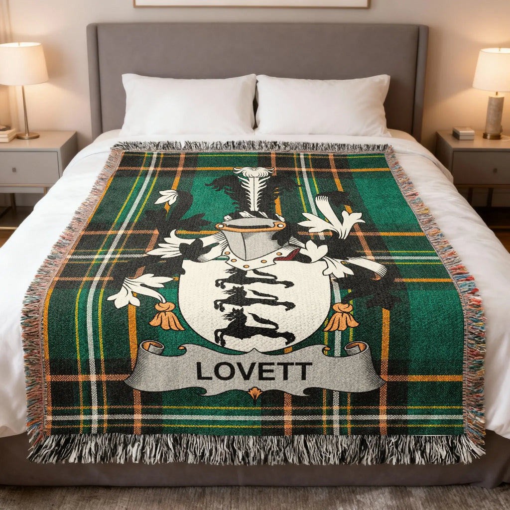 Plaid throw blanket featuring a coat of arms with the name "LOVETT" centered.