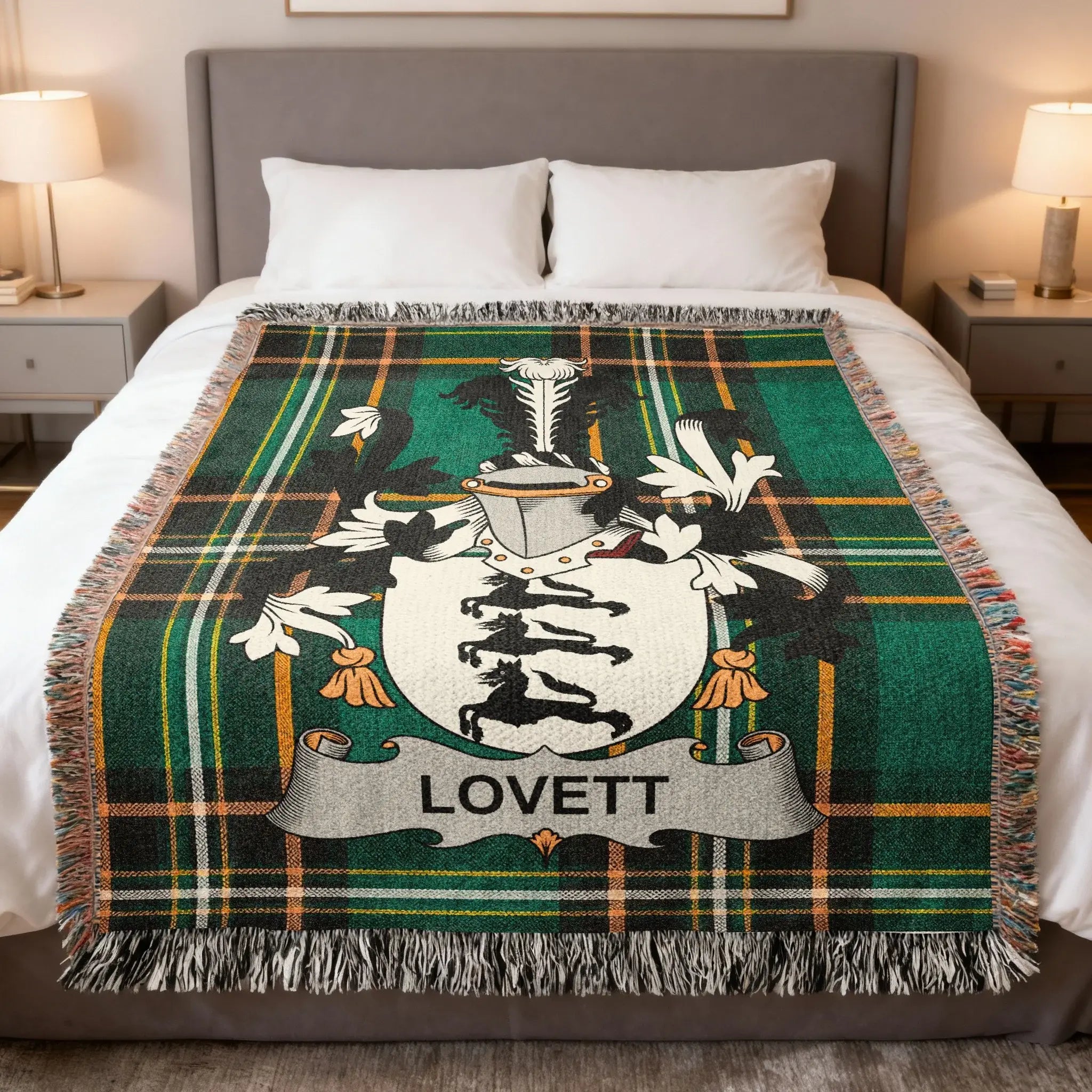 Plaid throw blanket featuring a coat of arms with the name "LOVETT" centered.