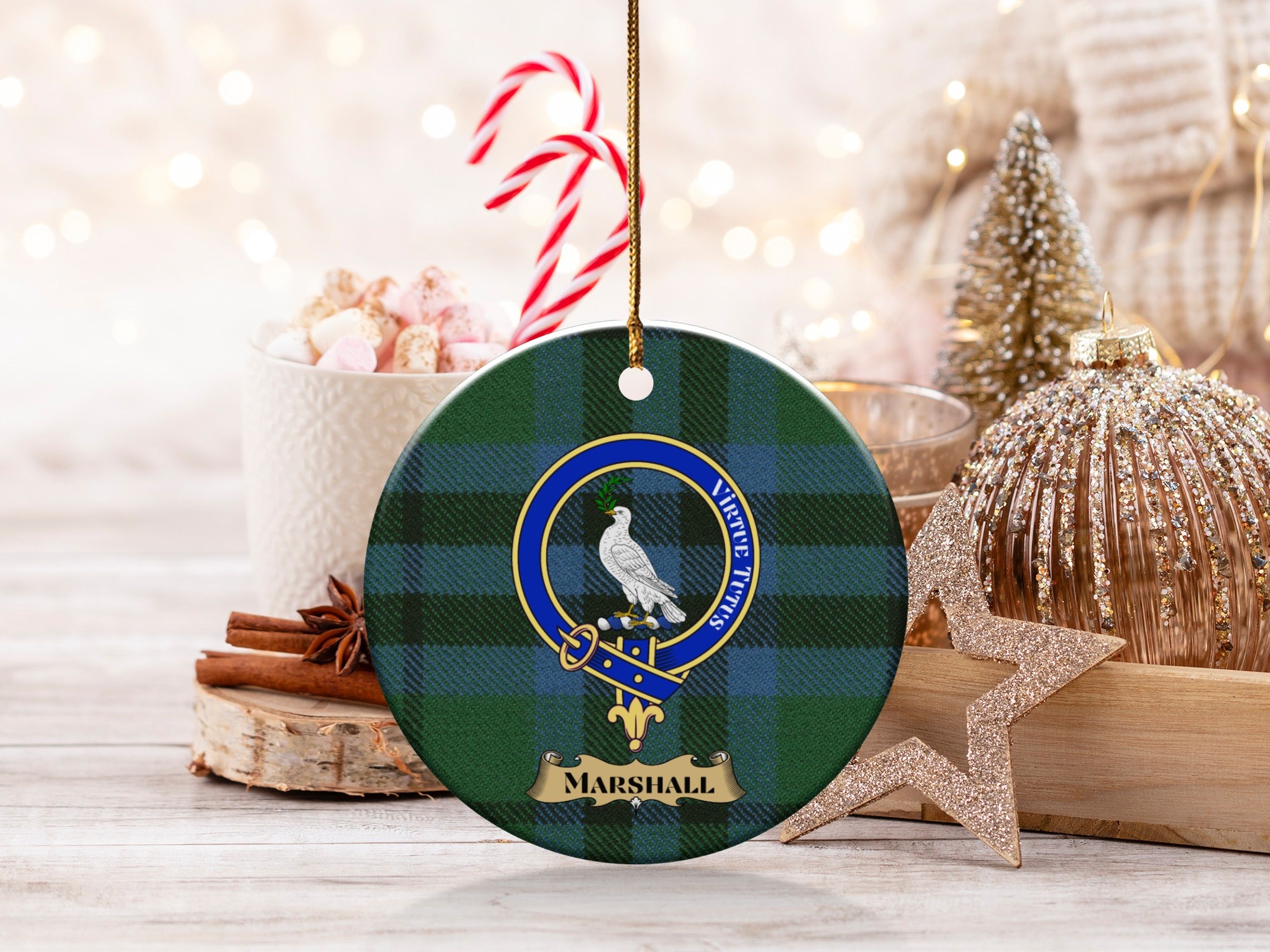 Marshall clan tartan ornament with crest beside candy canes — holiday scene
