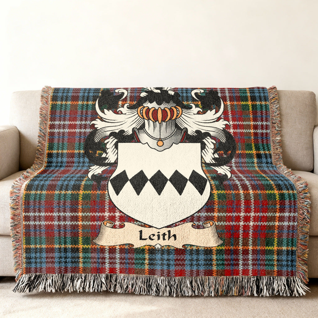 Leith family crest emblem on a Caledonia tartan woven blanket