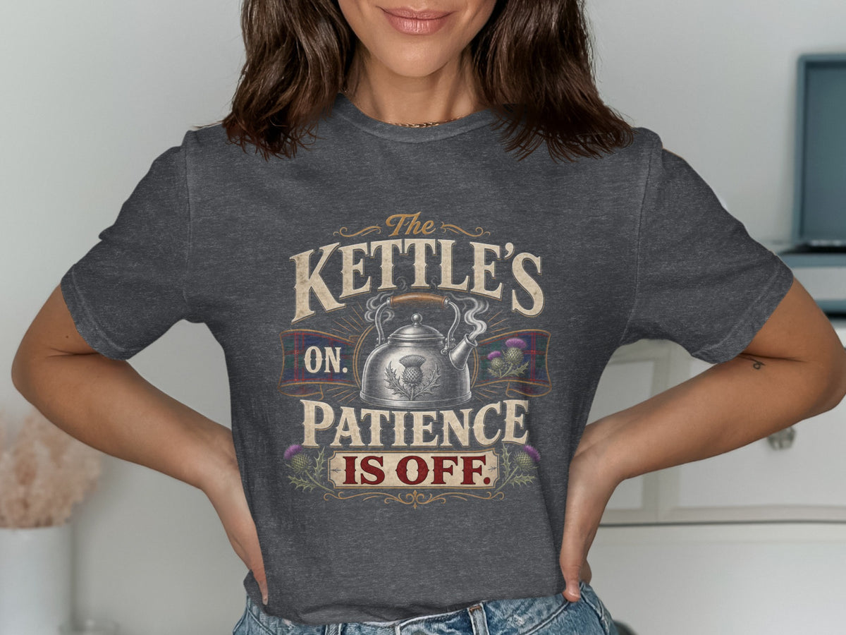 Dark gray t-shirt with "The Kettle's On. Patience Is Off." text, kettle, and thistles.