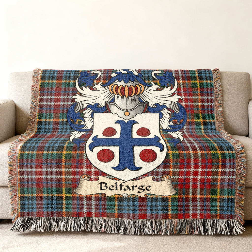 Belfarge Scottish family shield woven blanket with Caledonia tartan background on a sofa