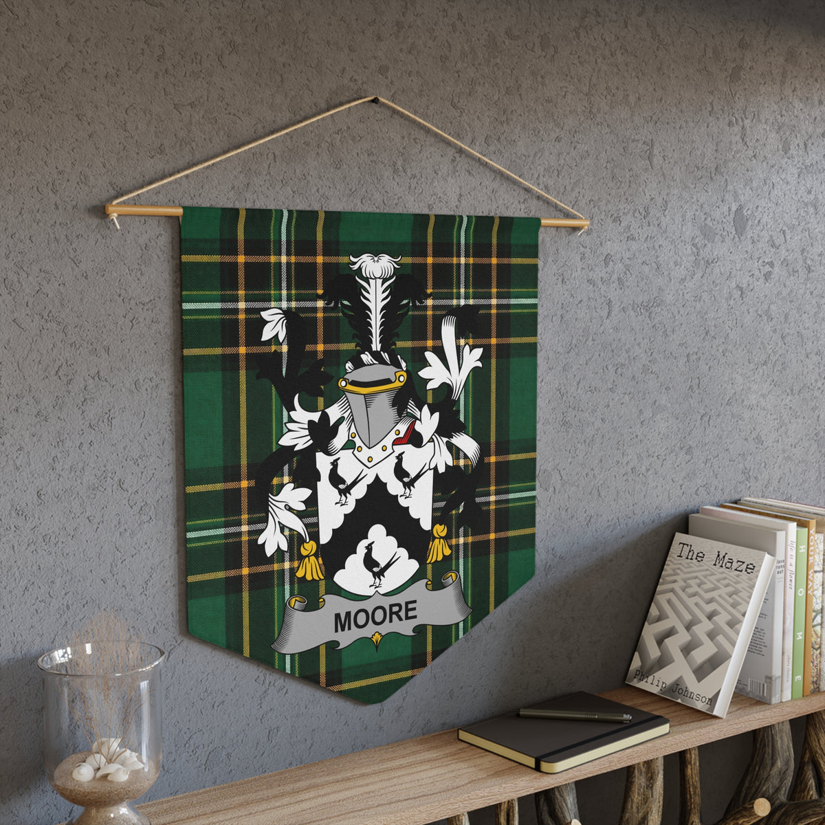 Pennant with Moore family crest on green plaid background.