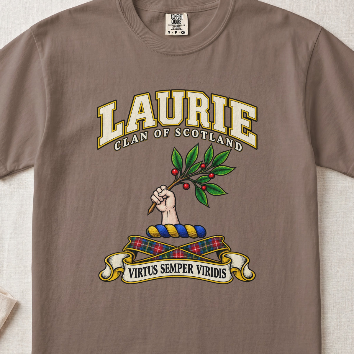 Laurie Scottish clan T-shirt in Espresso, front view with a hand holding a leafy branch with red berries and motto design.