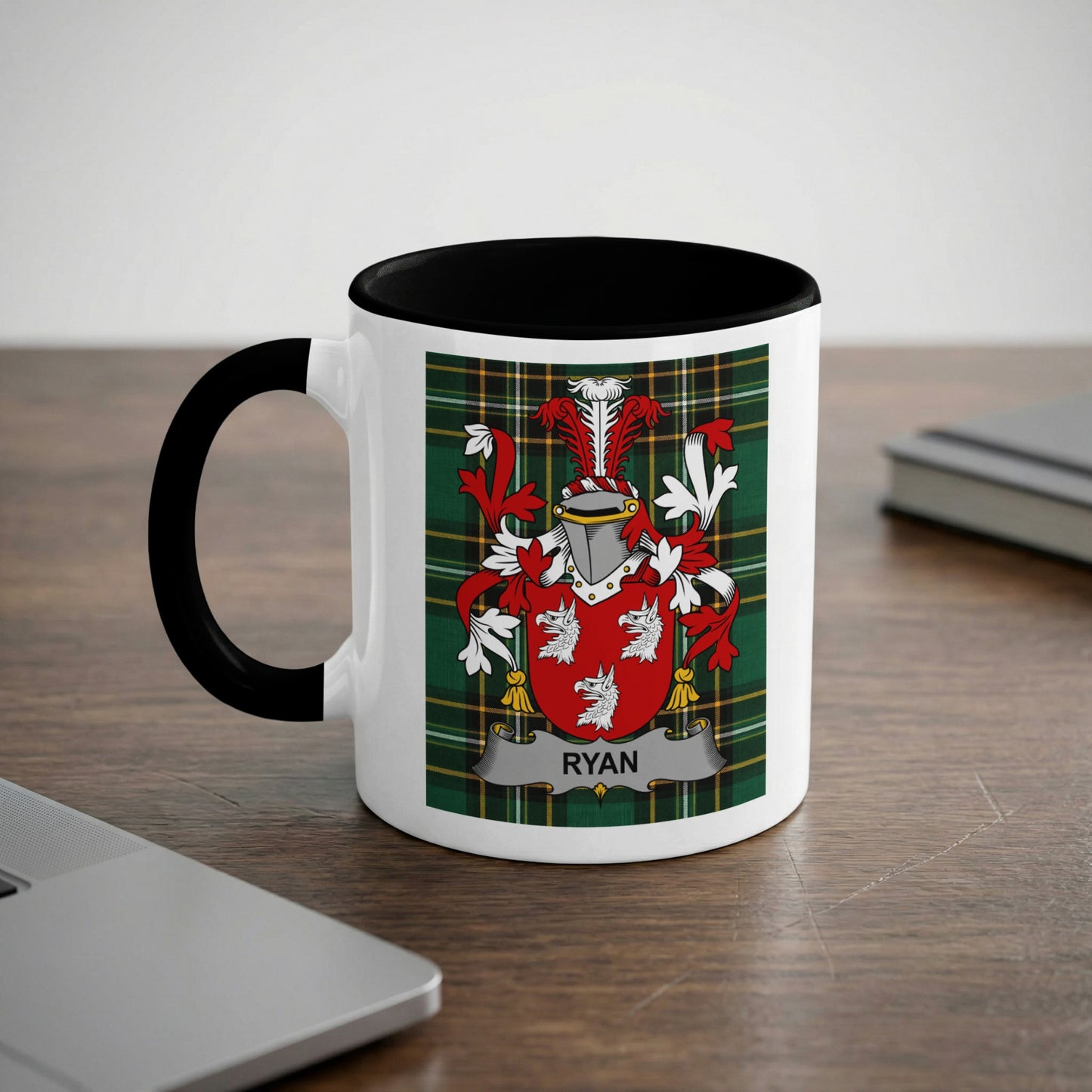 White mug with black rim featuring the Ryan family crest on a tartan background.