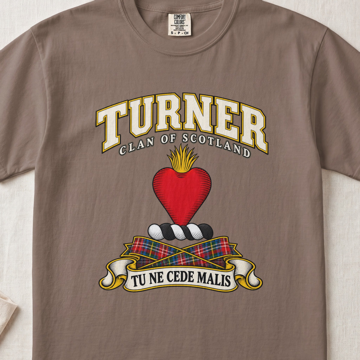 Turner Scottish clan T-shirt in Espresso, front view with a red heart topped with golden flames and motto banner.