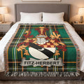 Tartan blanket with Fitz-Herbert coat of arms on a bed.