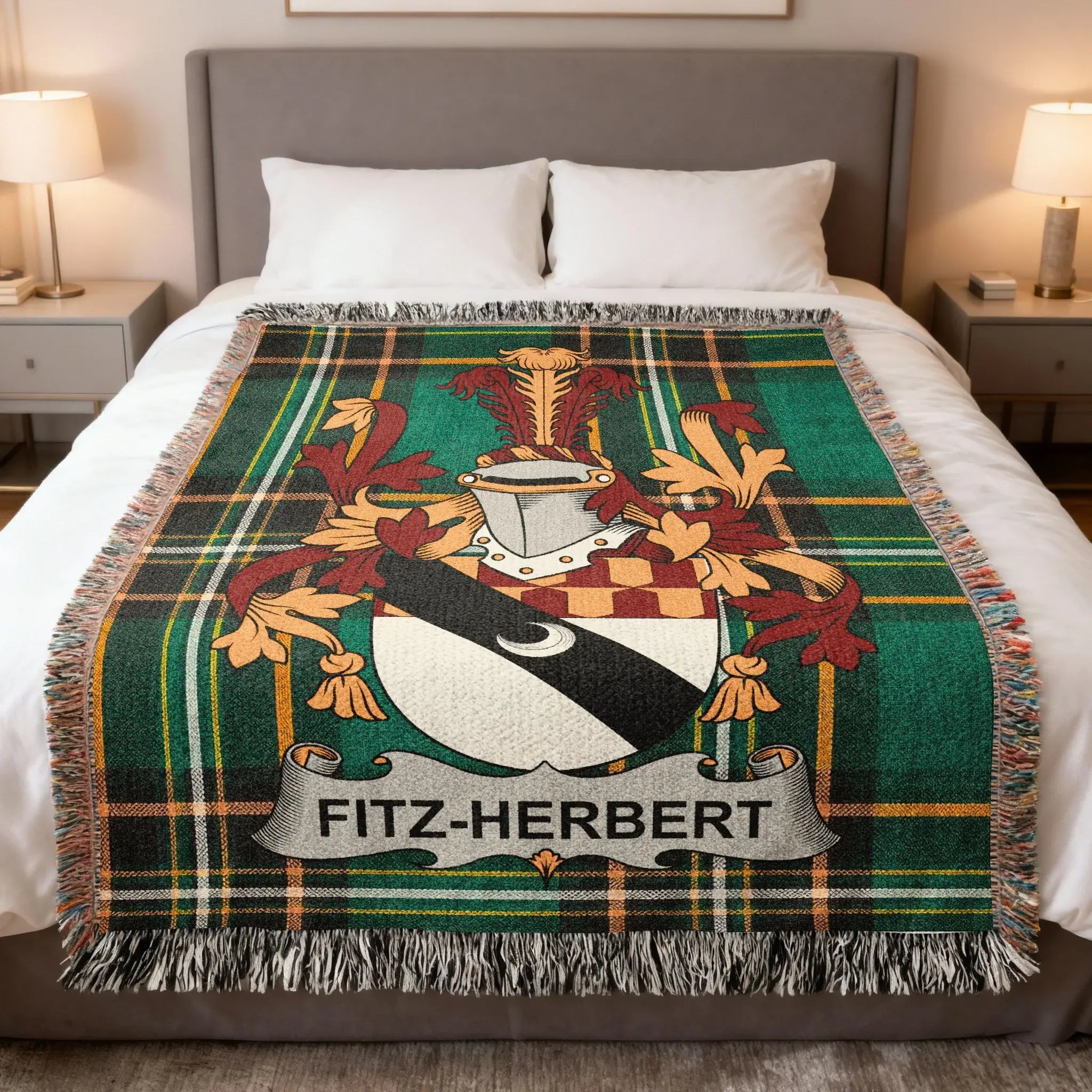 Tartan blanket with Fitz-Herbert coat of arms on a bed.