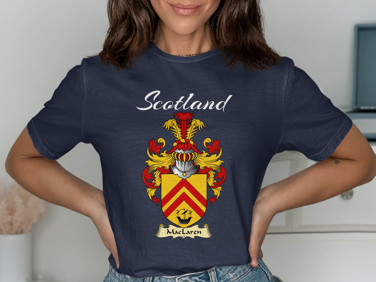 Model wearing a navy MacLaren T-shirt featuring red chevrons on a gold shield
