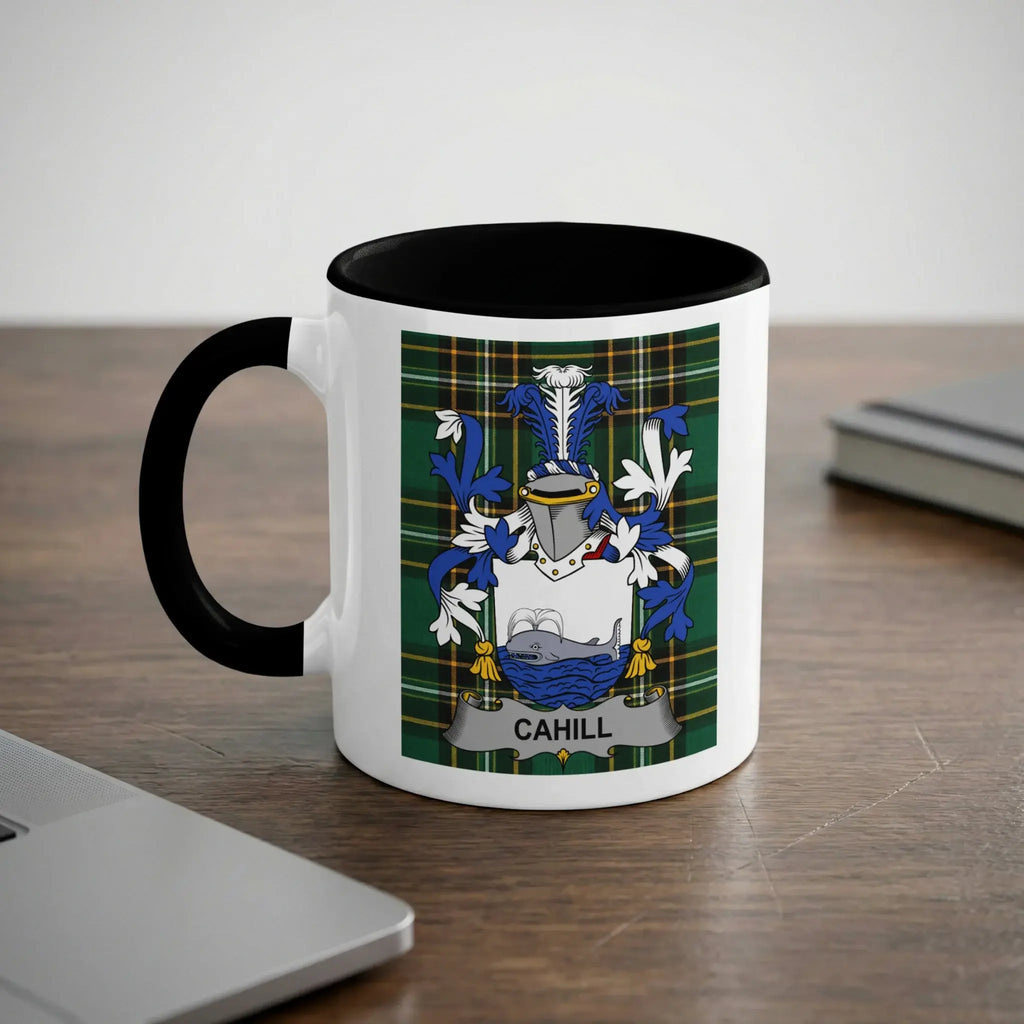 White mug with black rim featuring the Cahill family crest against a plaid background.