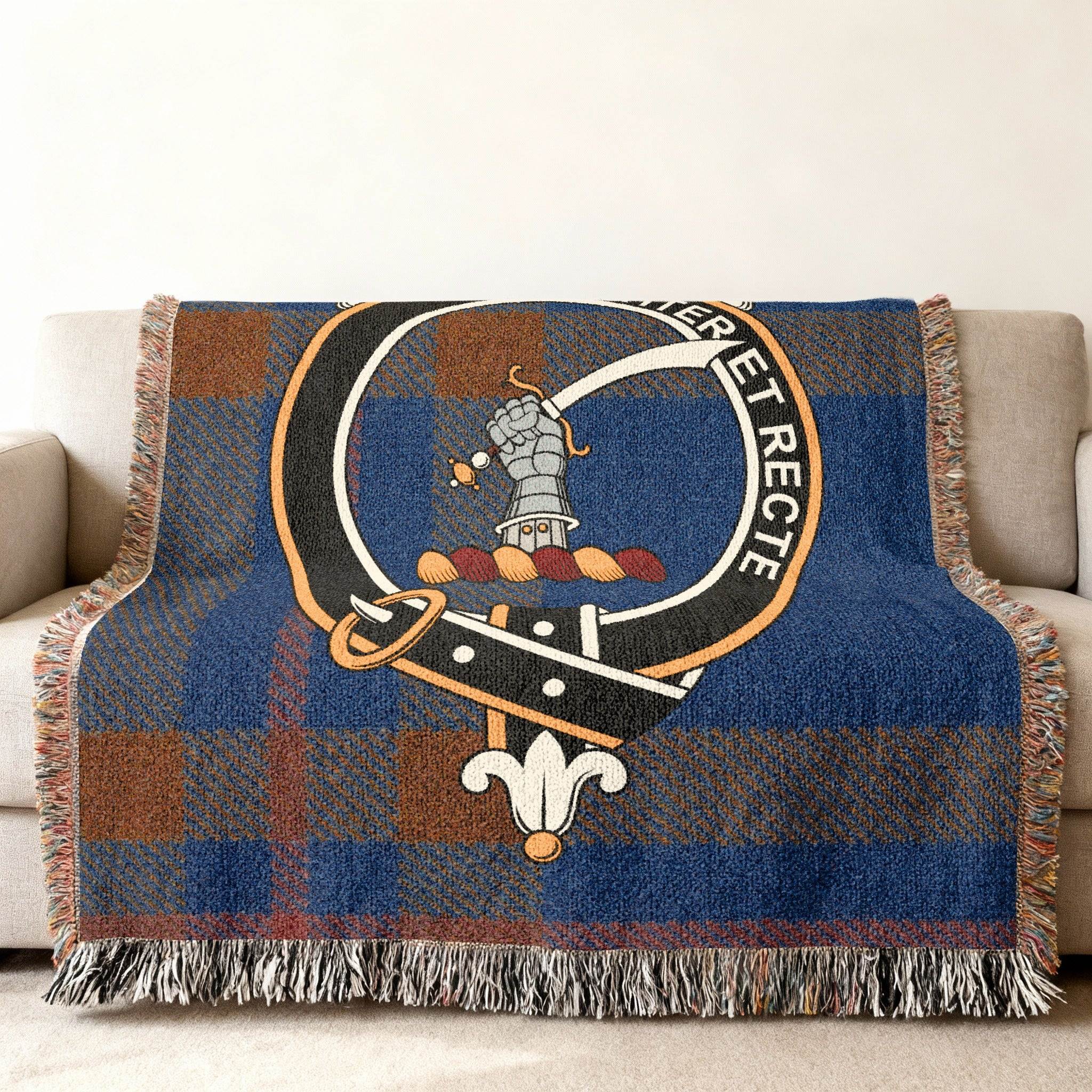 Elliot clan crest woven tartan blanket — cotton throw draped over sofa