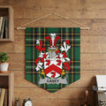 Casey family crest on a green plaid pennant banner hanging on a wooden wall.
